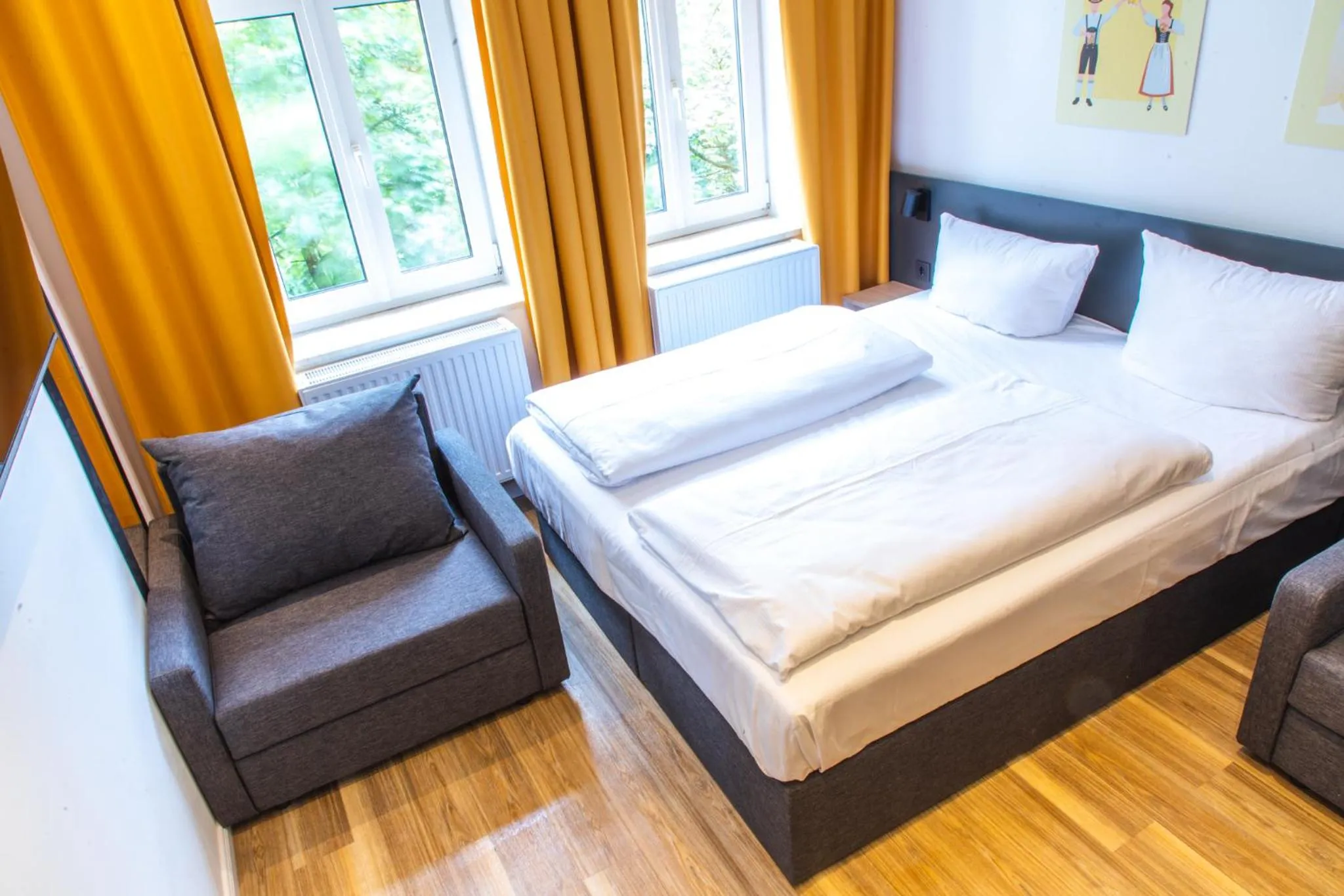 Bed in Servus Apartments by Homaris