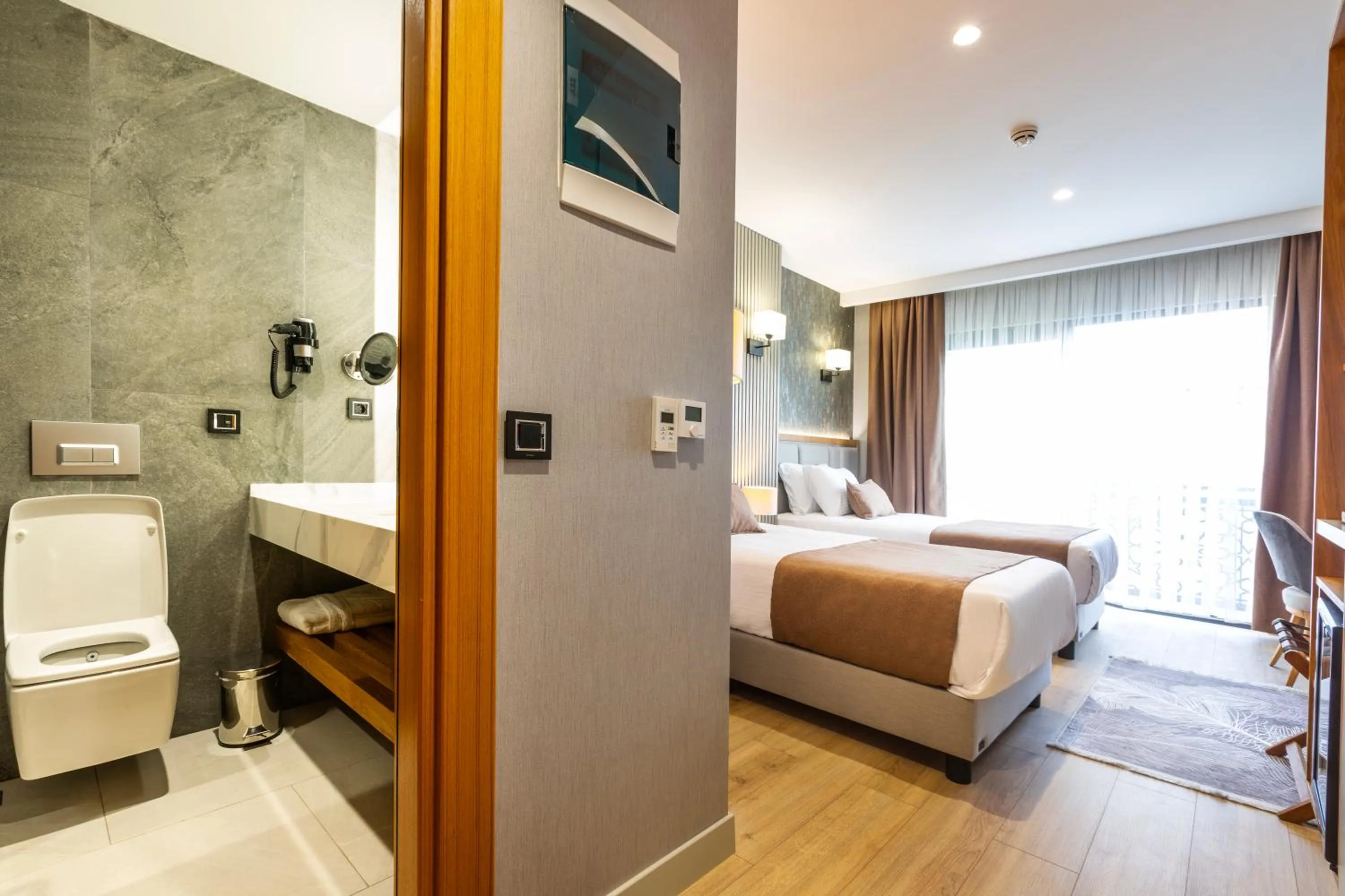 Toilet, Bed in North Star Hotel