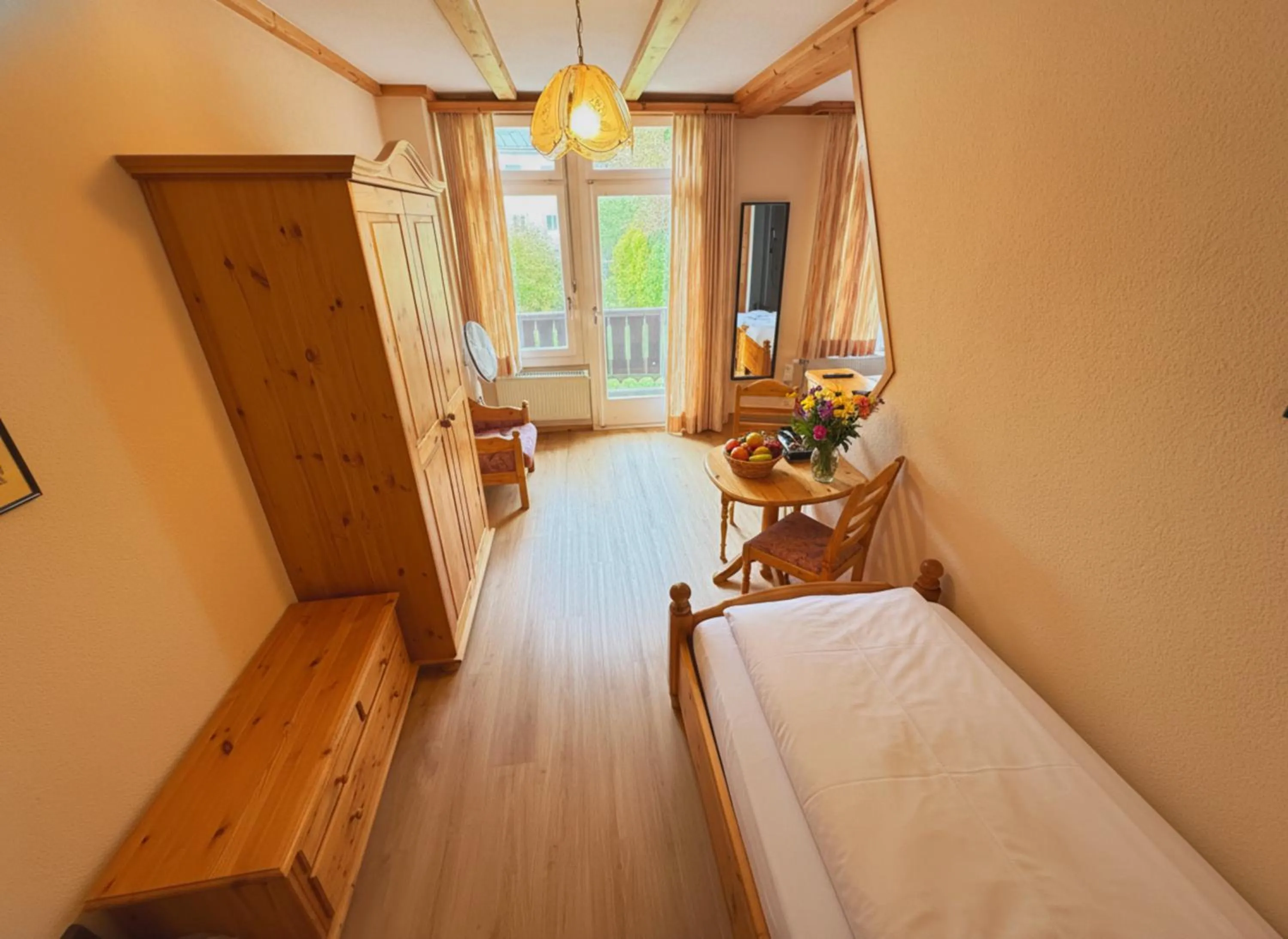 Living room, Bed in Beatenberg Resort & Spa in Beatenberg Interlaken