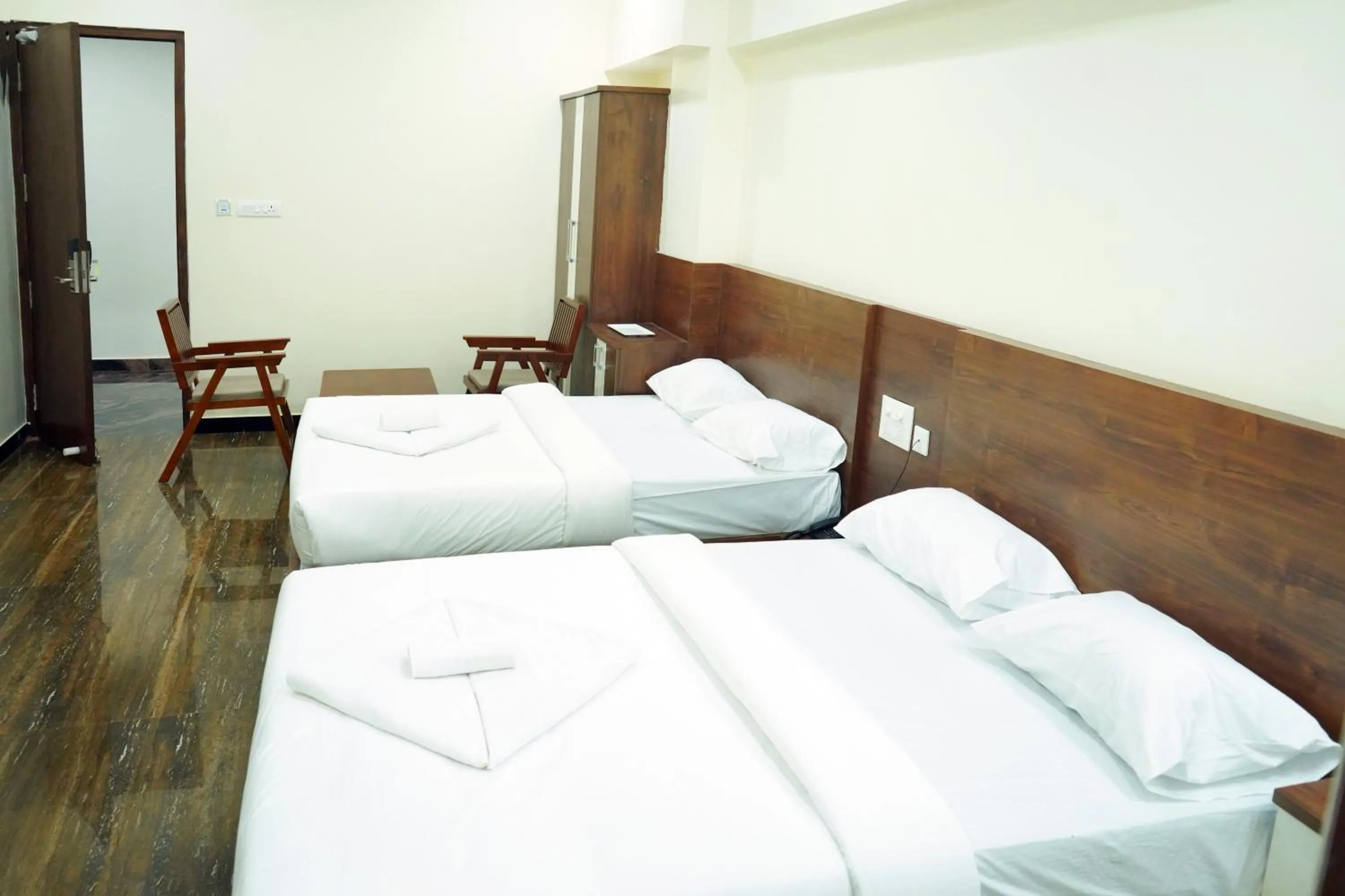 Bed in HOTEL NIVETHA INN