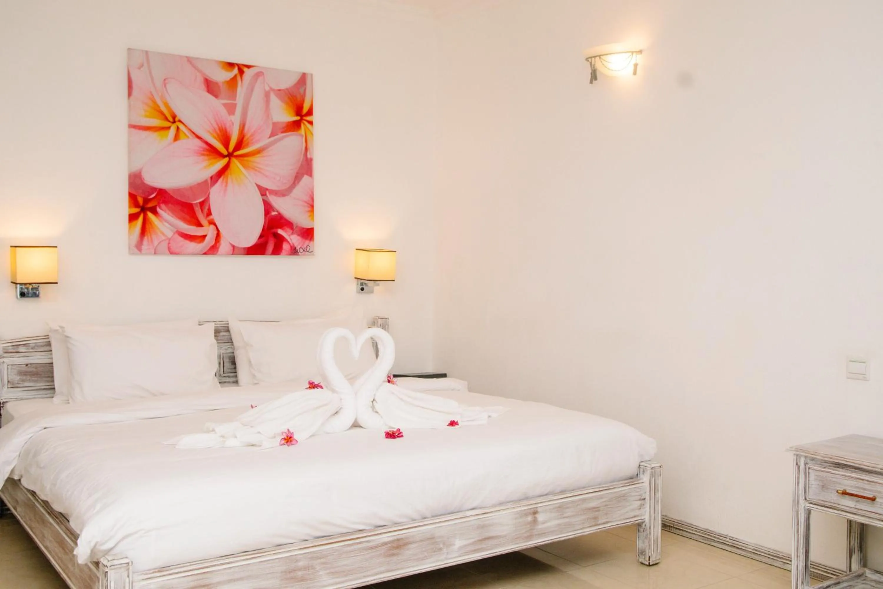 Bed in Hibiscus Boutique Hotel