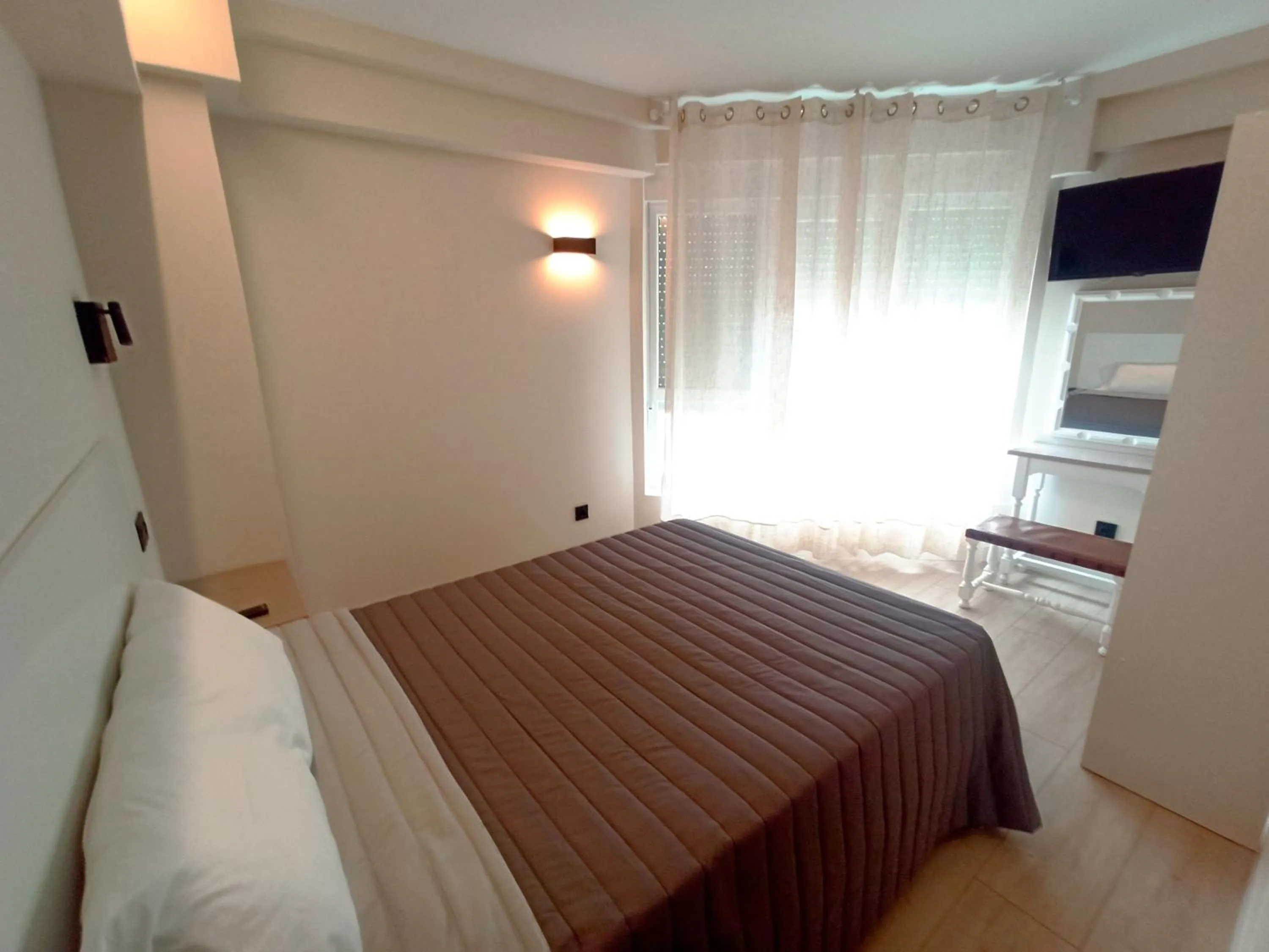 Bed in Bahia Rooms Cantabria 3000