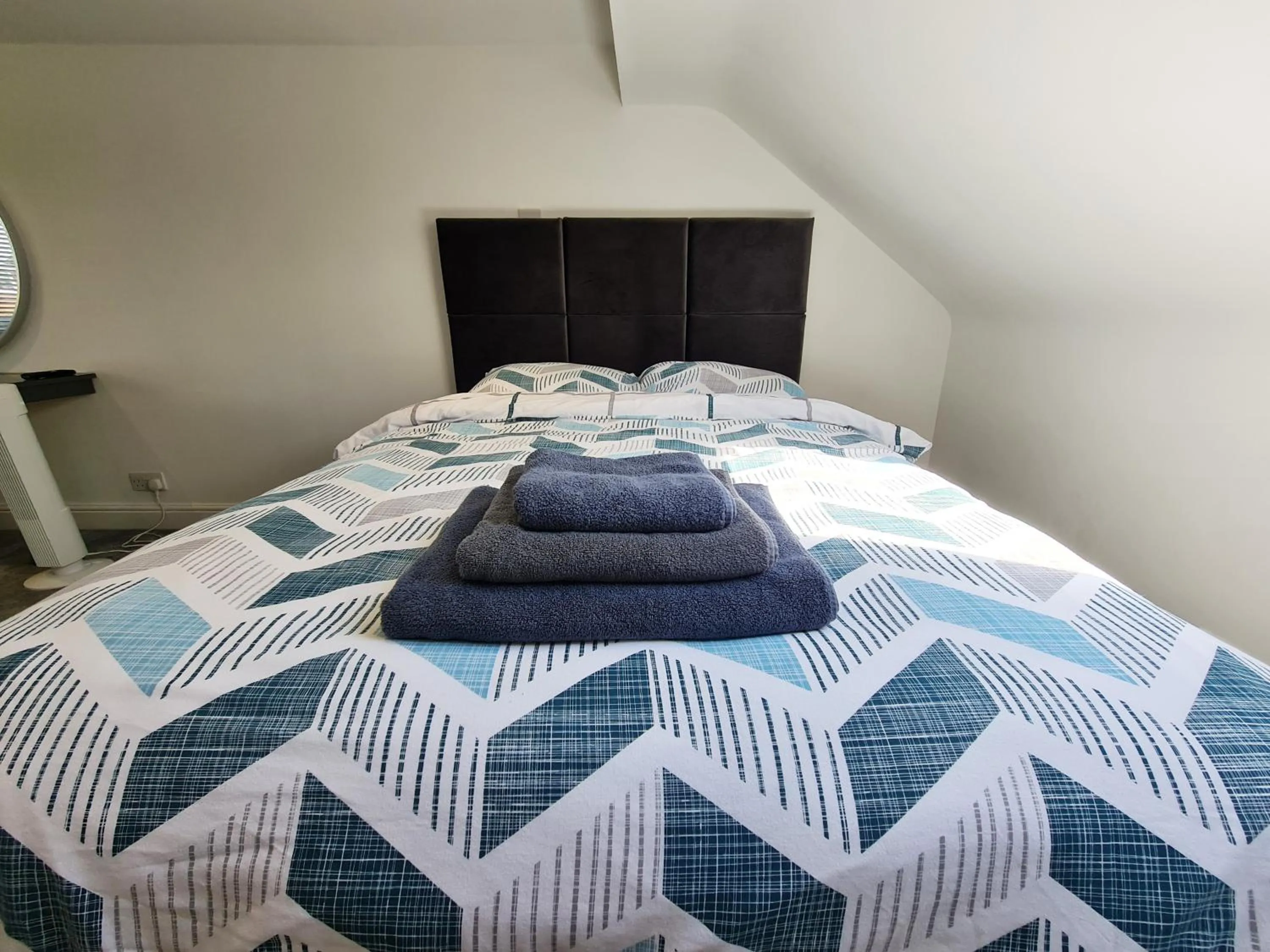 Bed in Stylish Suites with kitchenette