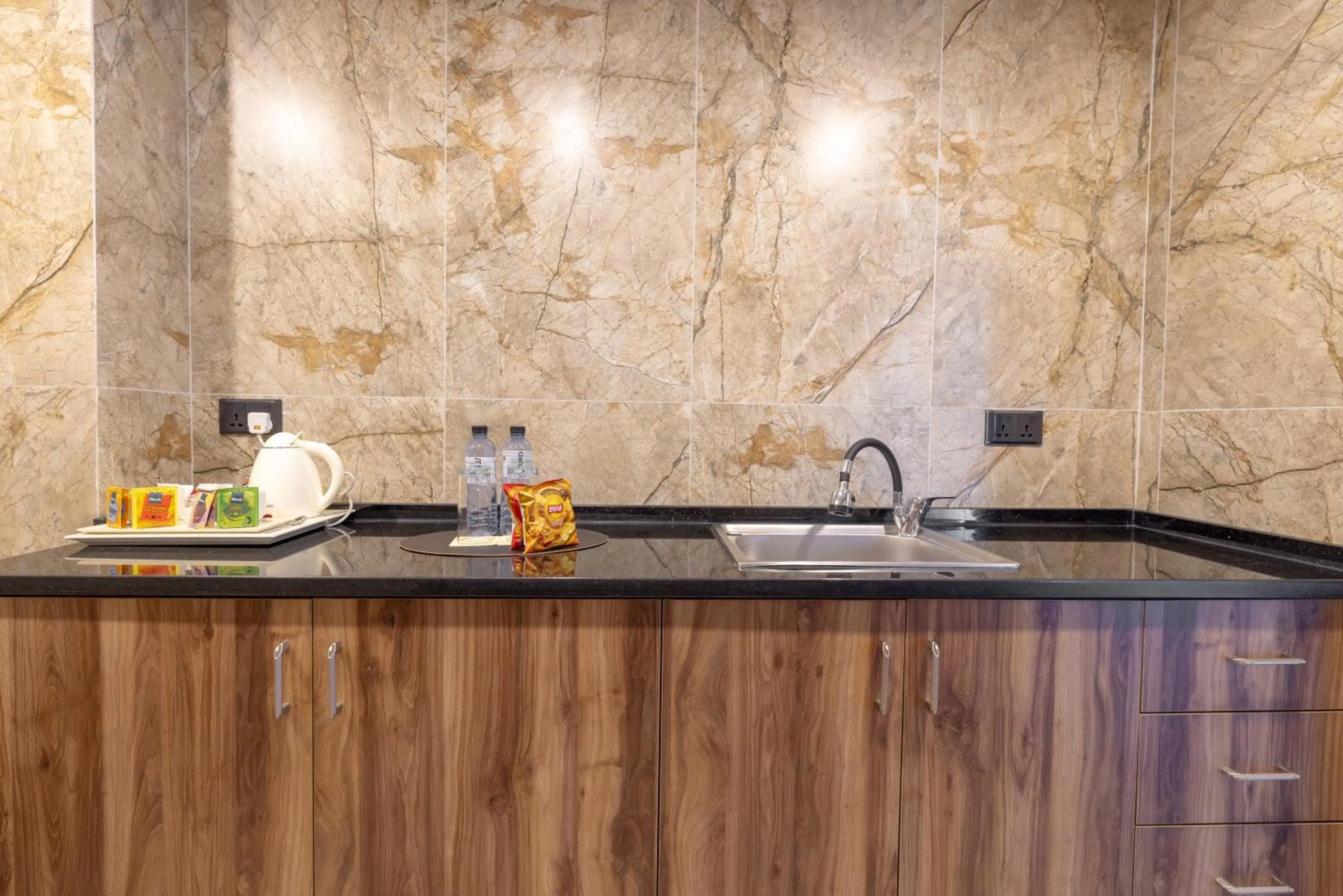 Kitchen or kitchenette in Jeddah Homes Boutique Hotel