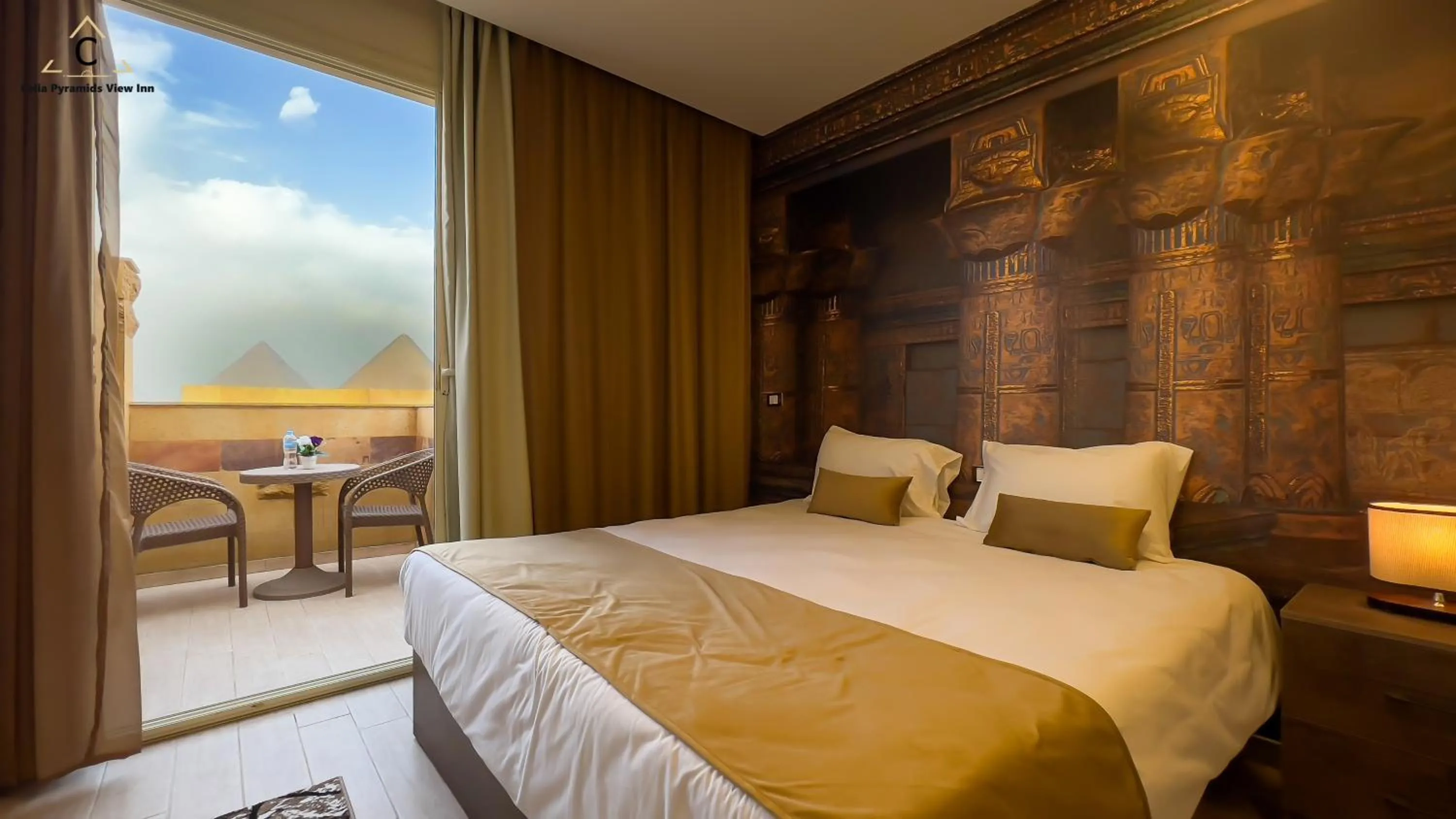 Bed in Celia Pyramids View inn