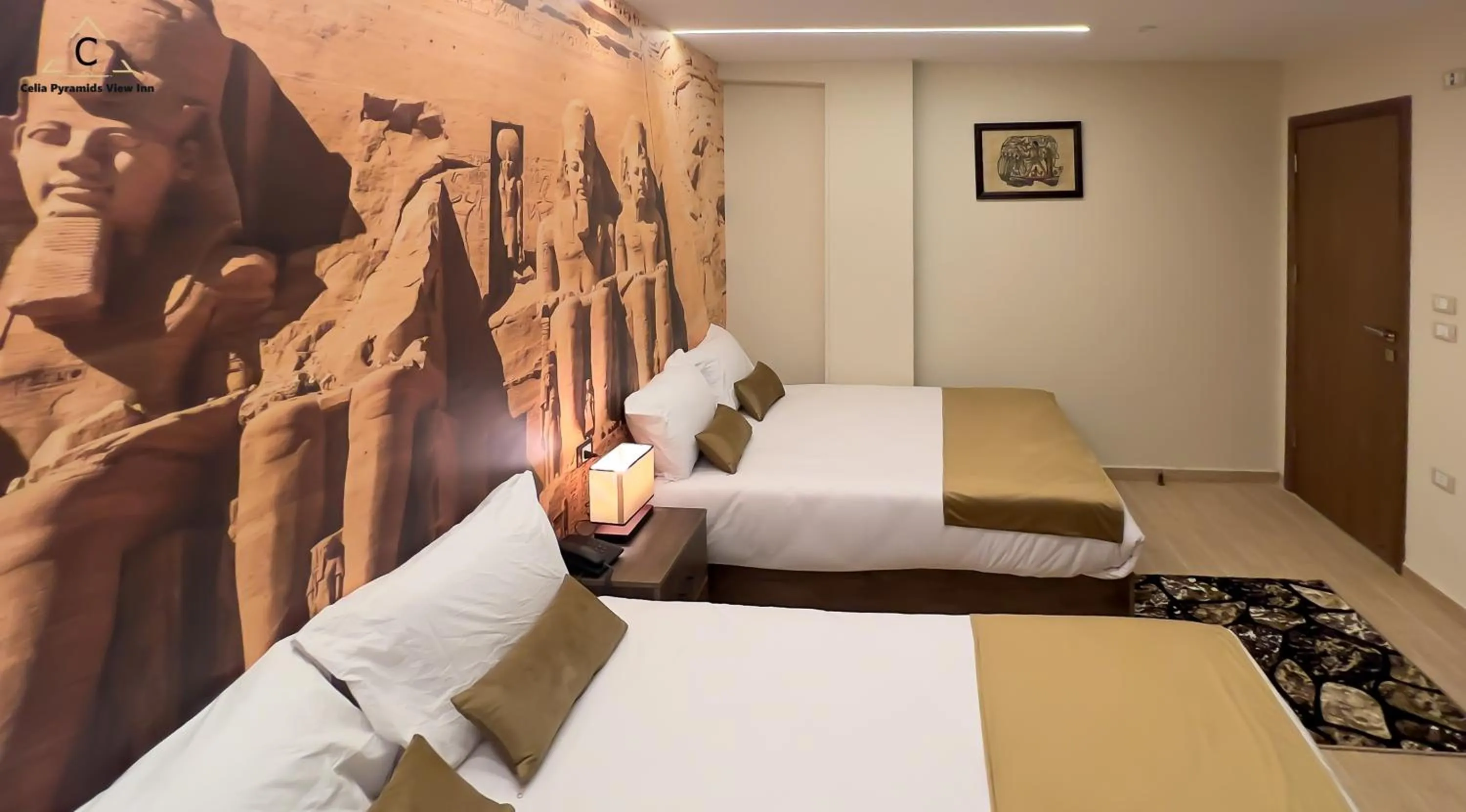 Bed in Celia Pyramids View inn