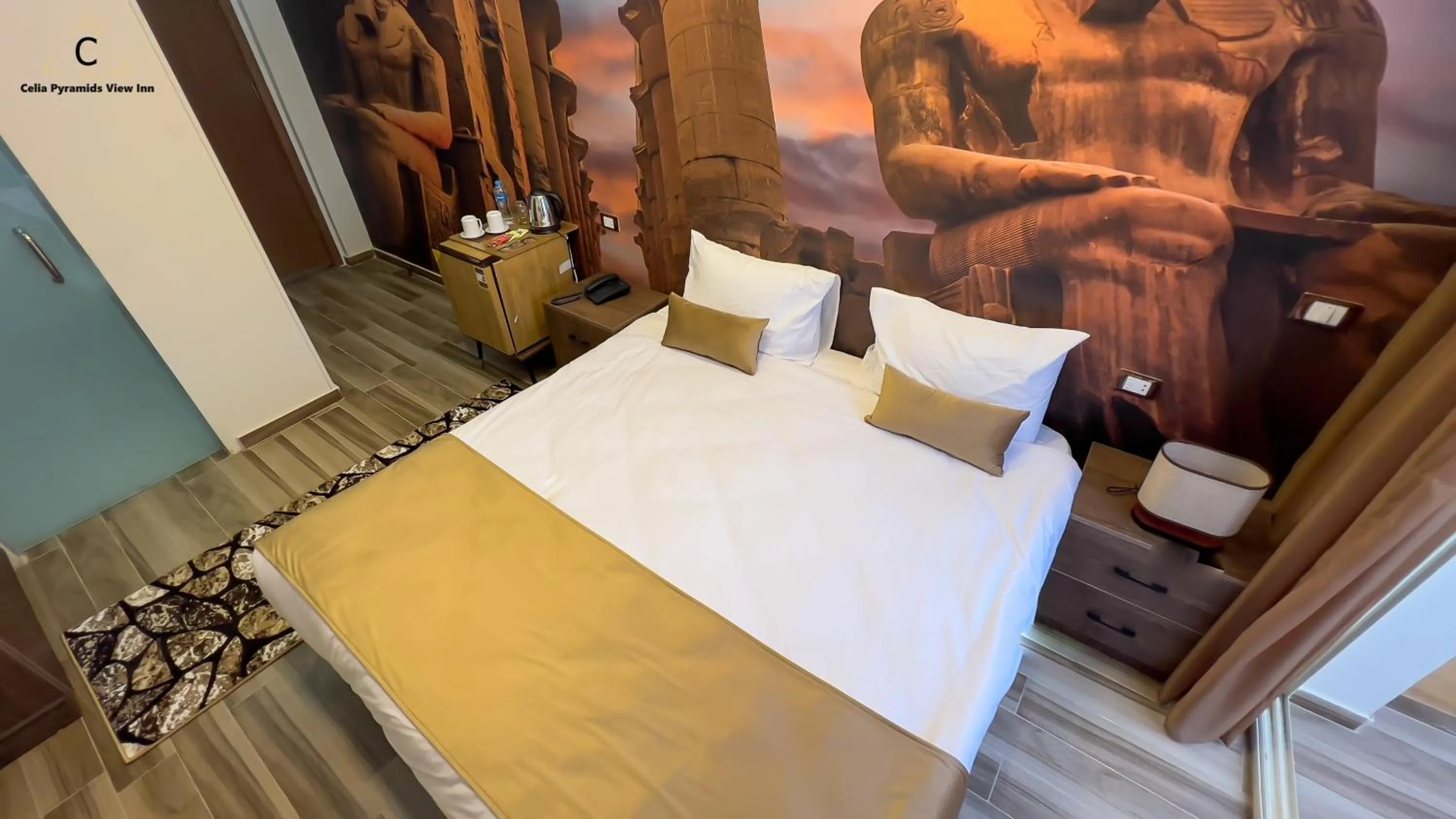 Bed in Celia Pyramids View inn