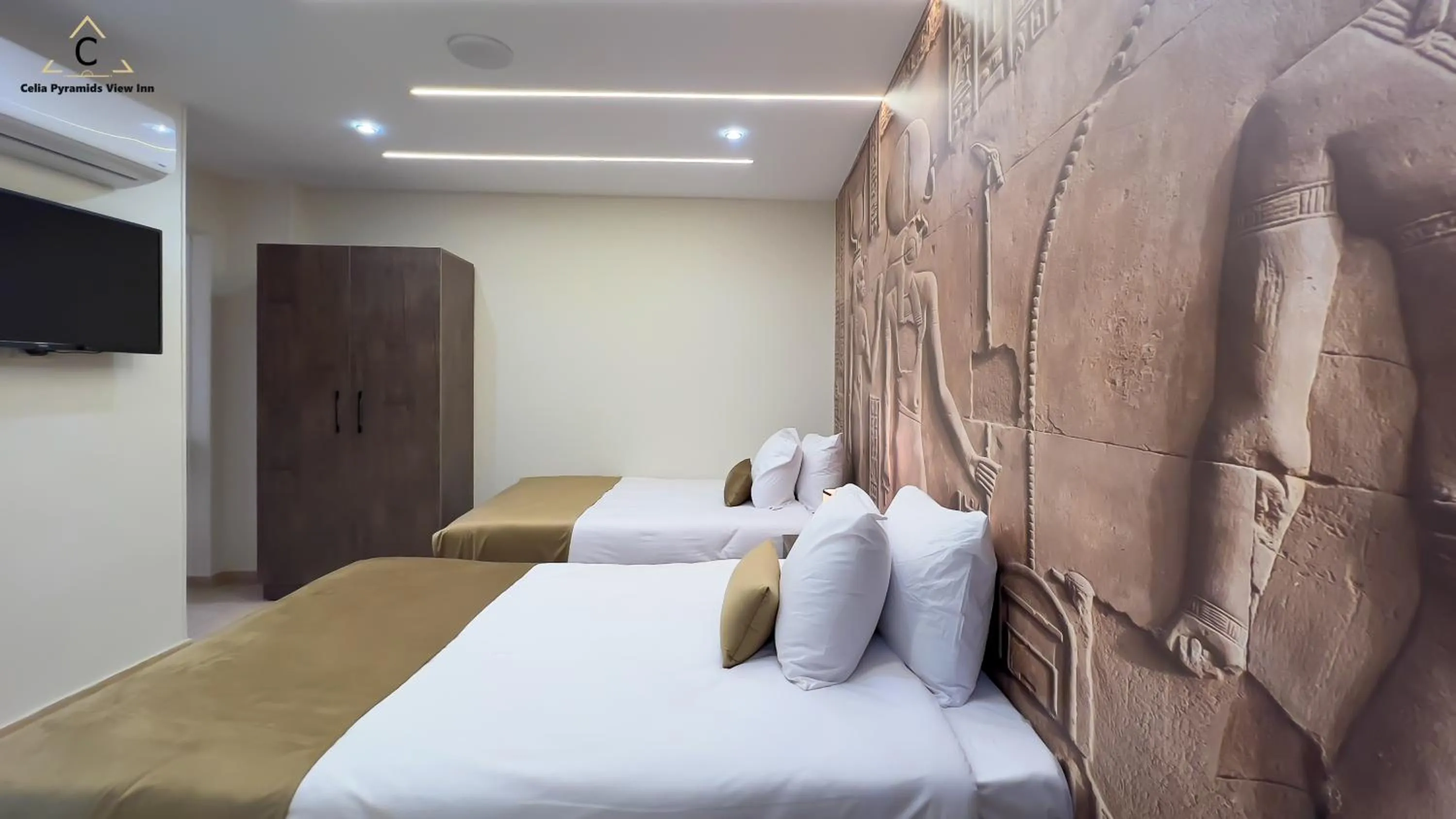 Bed in Celia Pyramids View inn