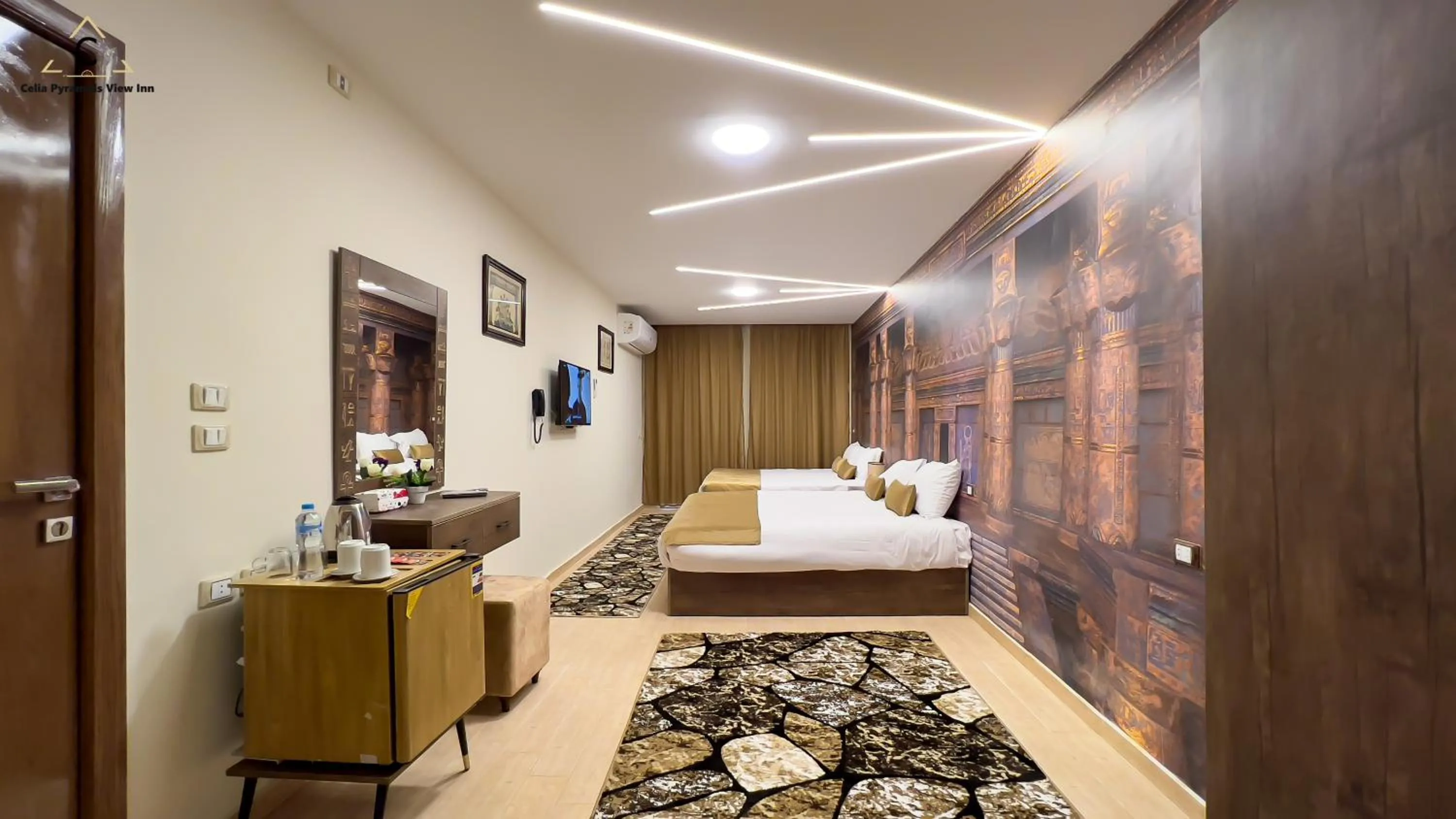 Bed in Celia Pyramids View inn