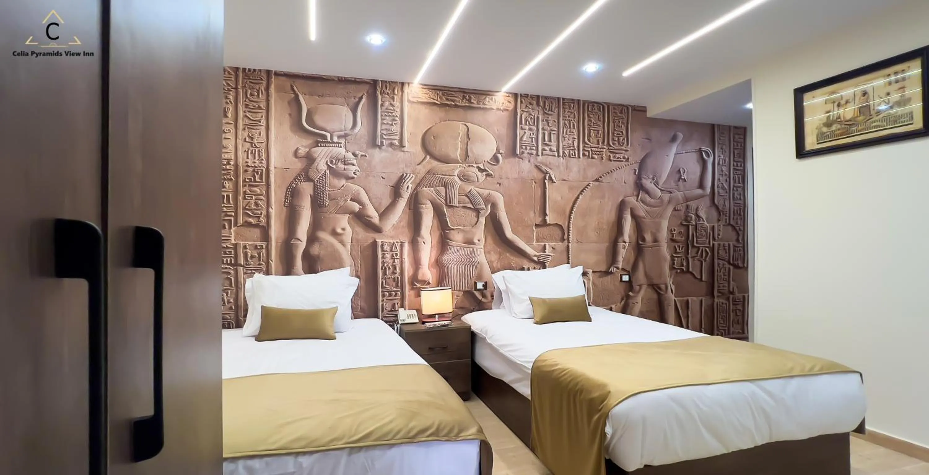 Bed in Celia Pyramids View inn