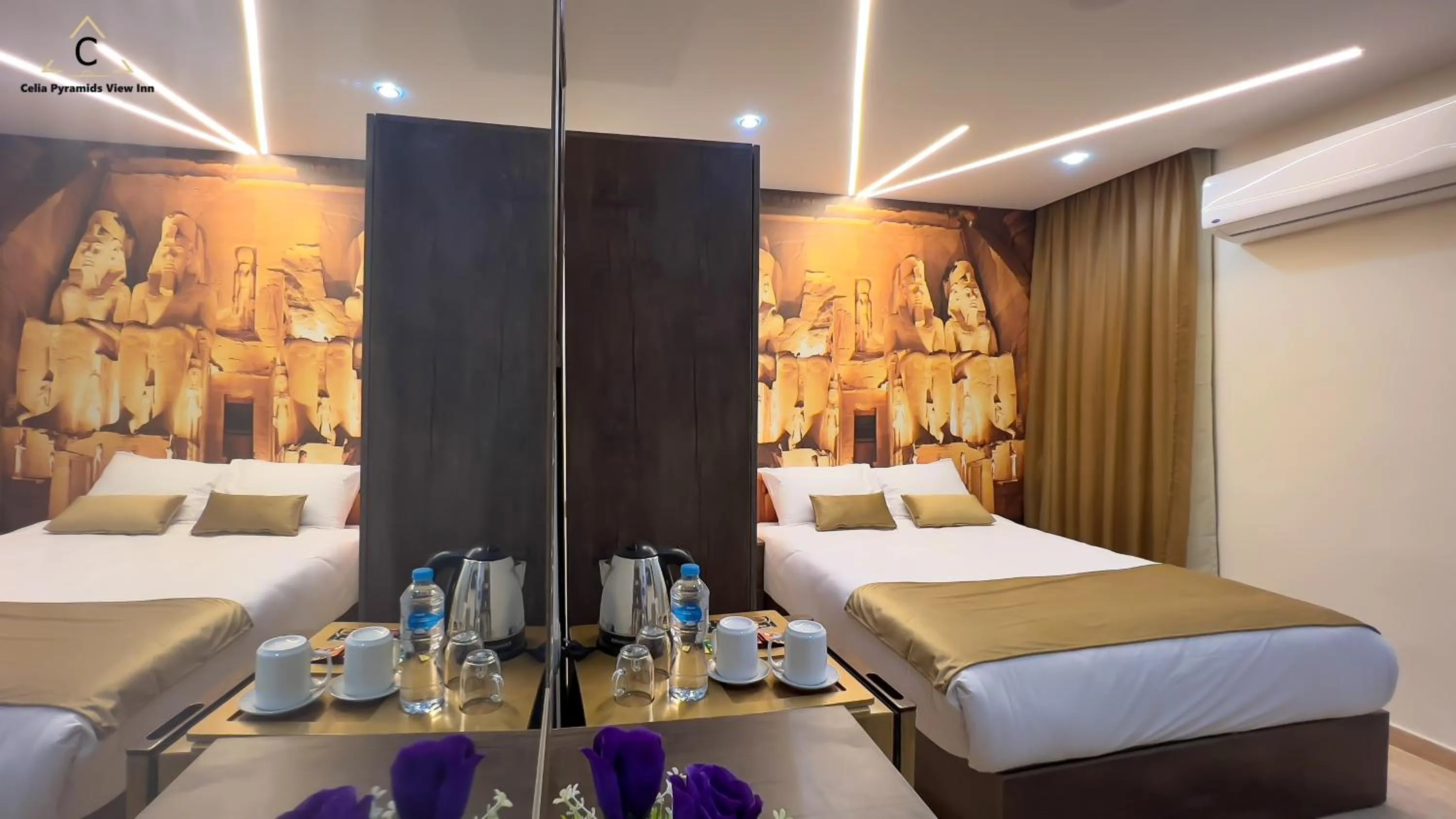 Bed in Celia Pyramids View inn