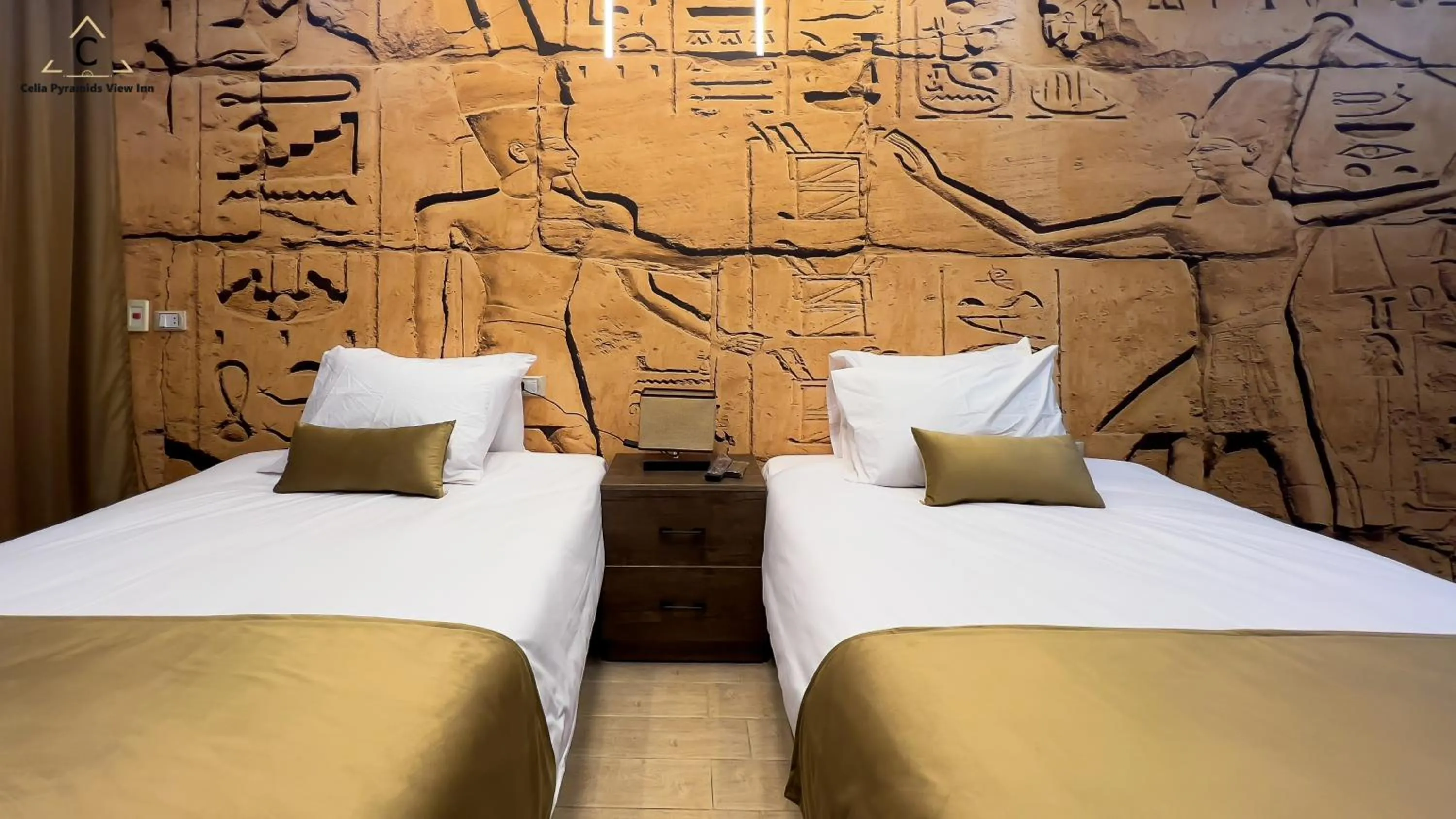 Bed in Celia Pyramids View inn