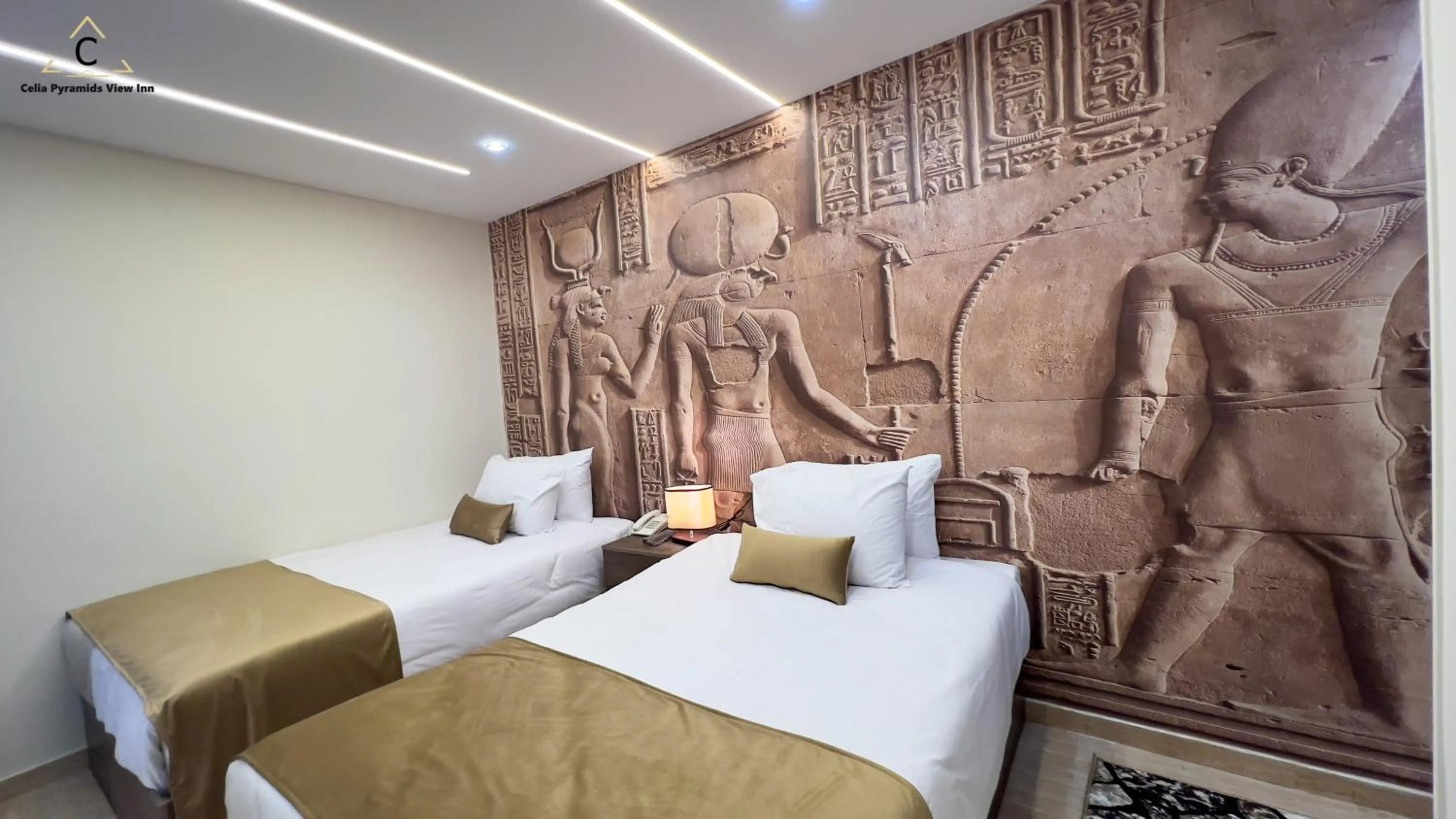 Bed in Celia Pyramids View inn