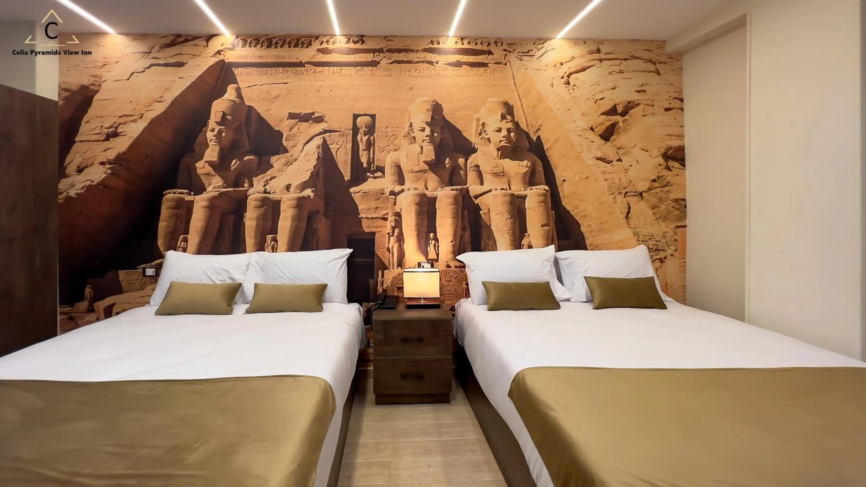 Bed in Celia Pyramids View inn