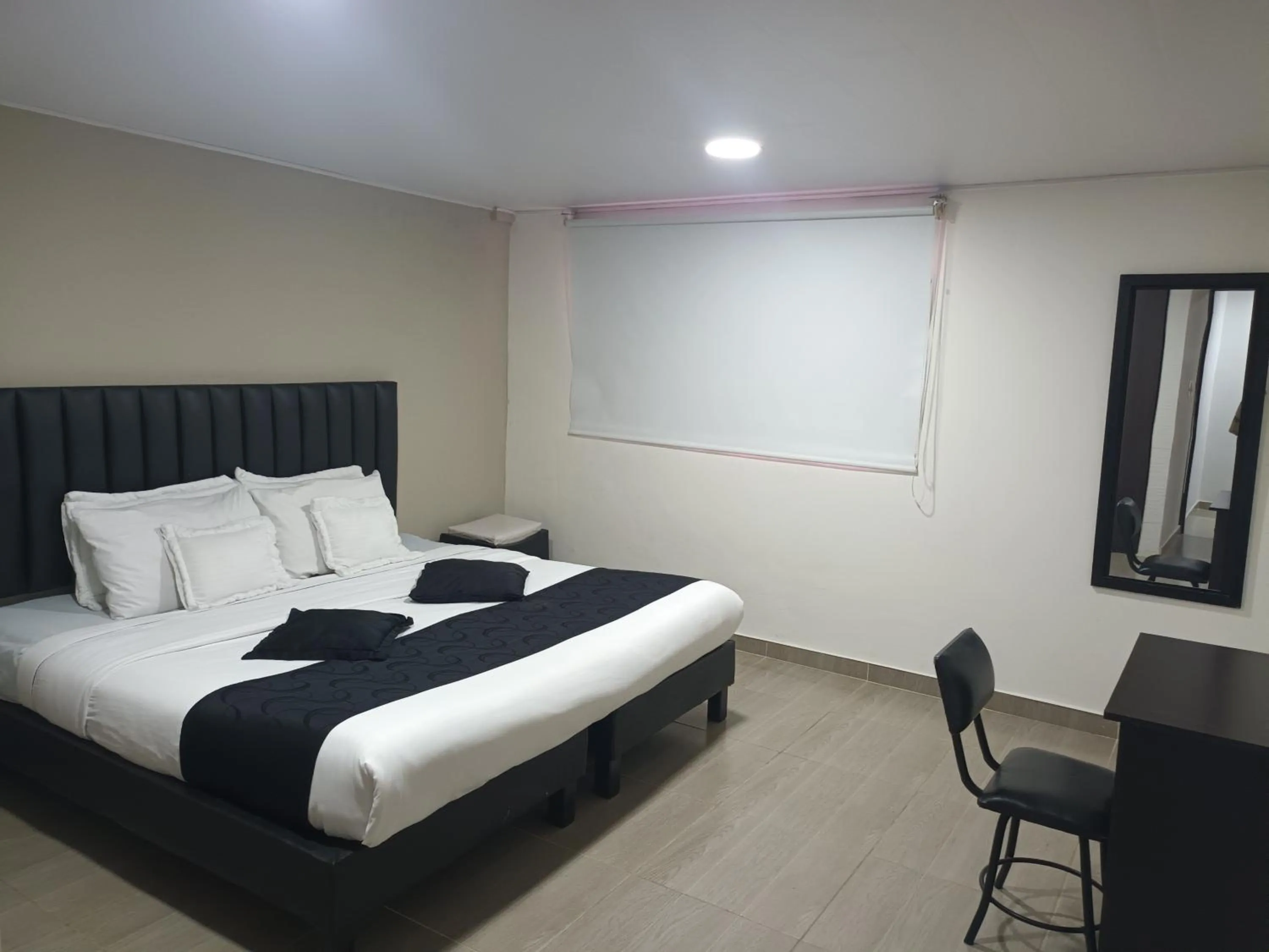 Bed in Hotel Santiago Plaza