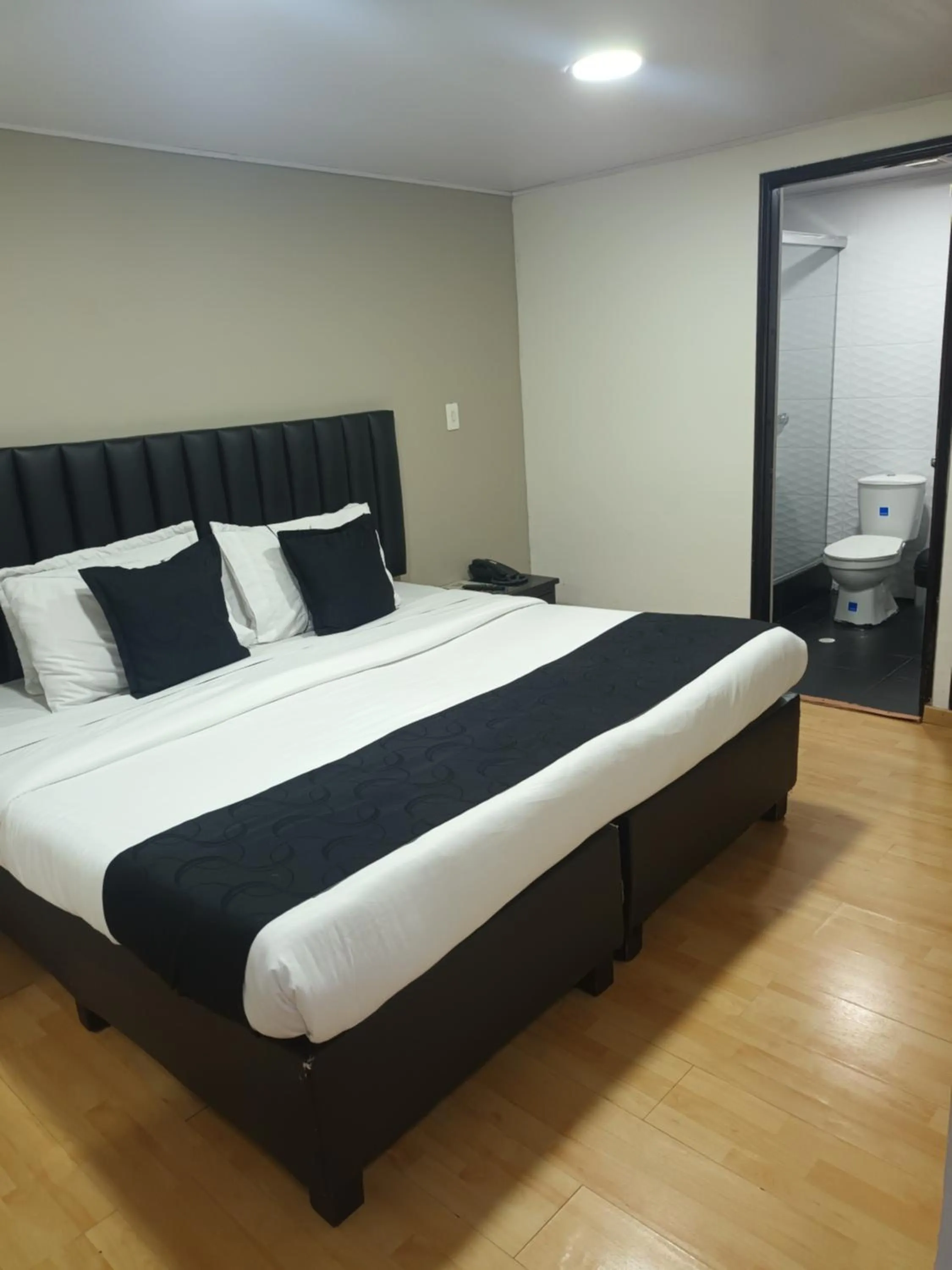 Bed in Hotel Santiago Plaza