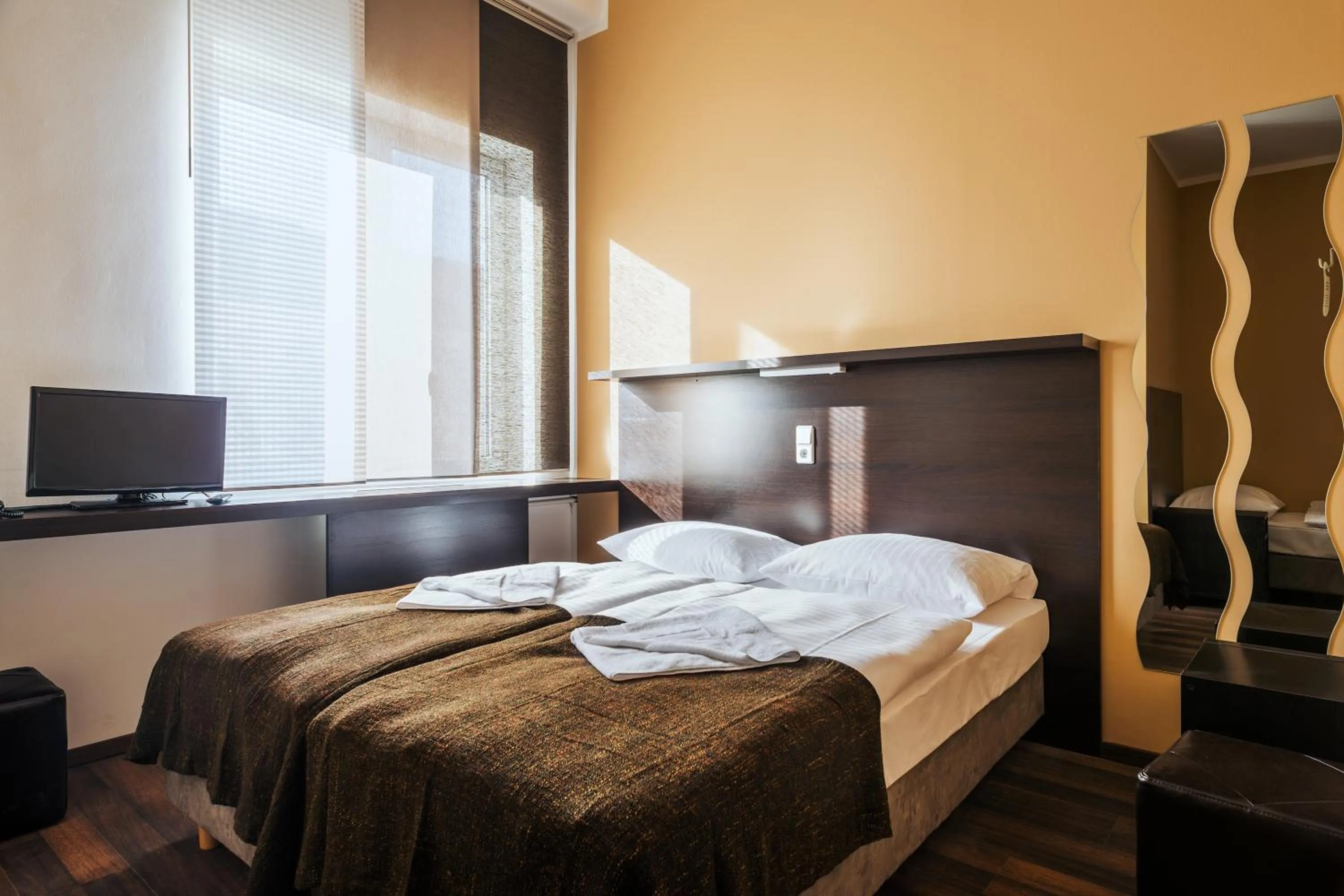 Bed in Apple City Hotel