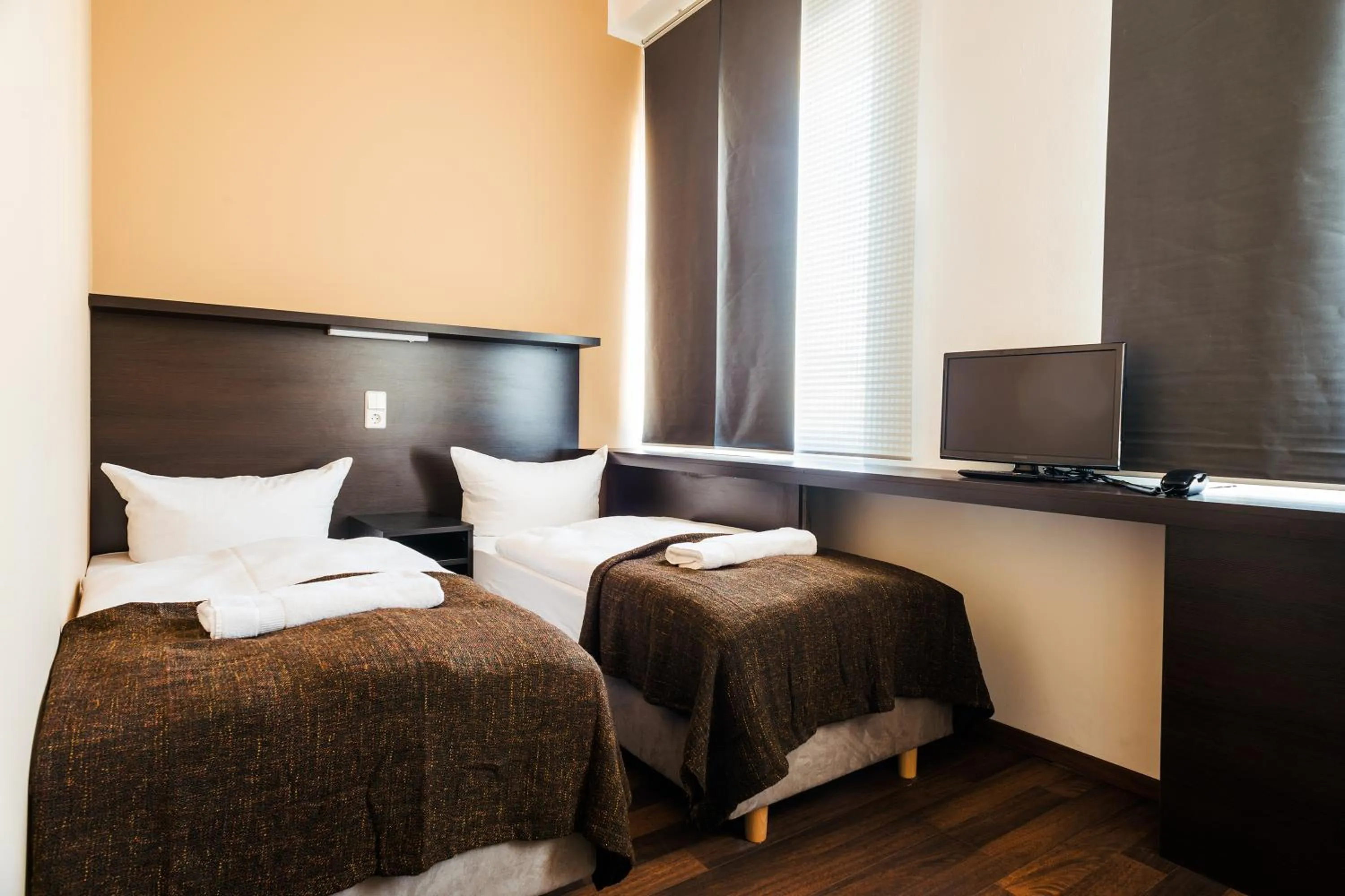 Bed in Apple City Hotel