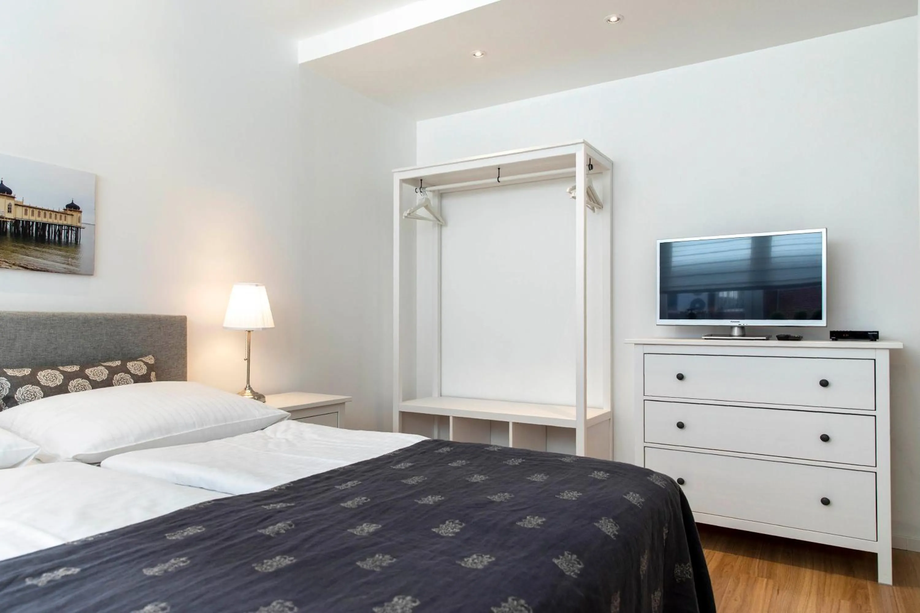 Bed in Luxx City Apartments