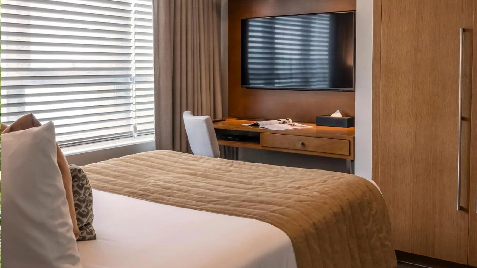 Bed in Aruga Apartments by Rockwell Makati