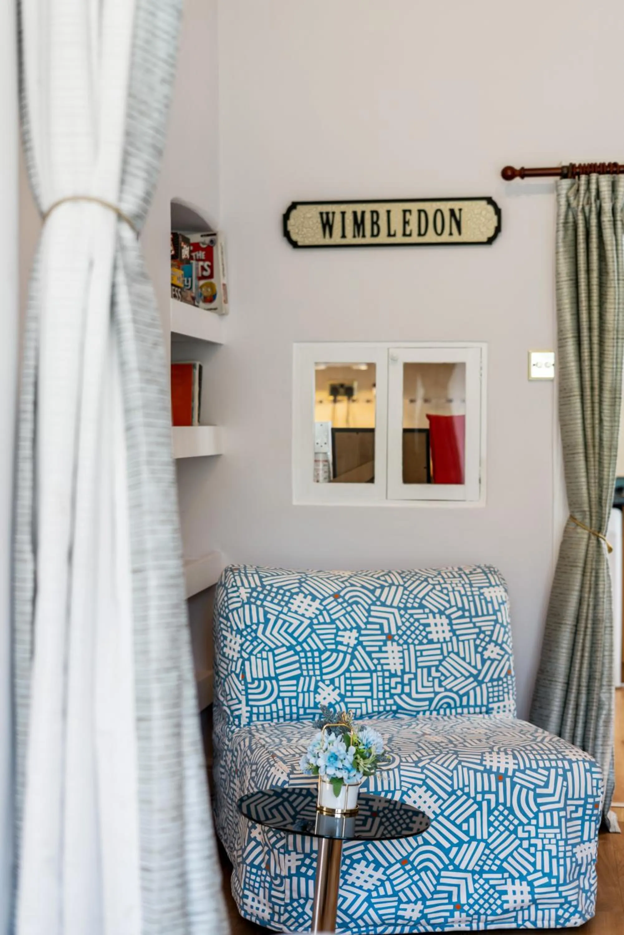 Seating area, Bed in Lovely garden apartment in Wimbledon Town Centre with private parking by Wimbledon Holiday Lets