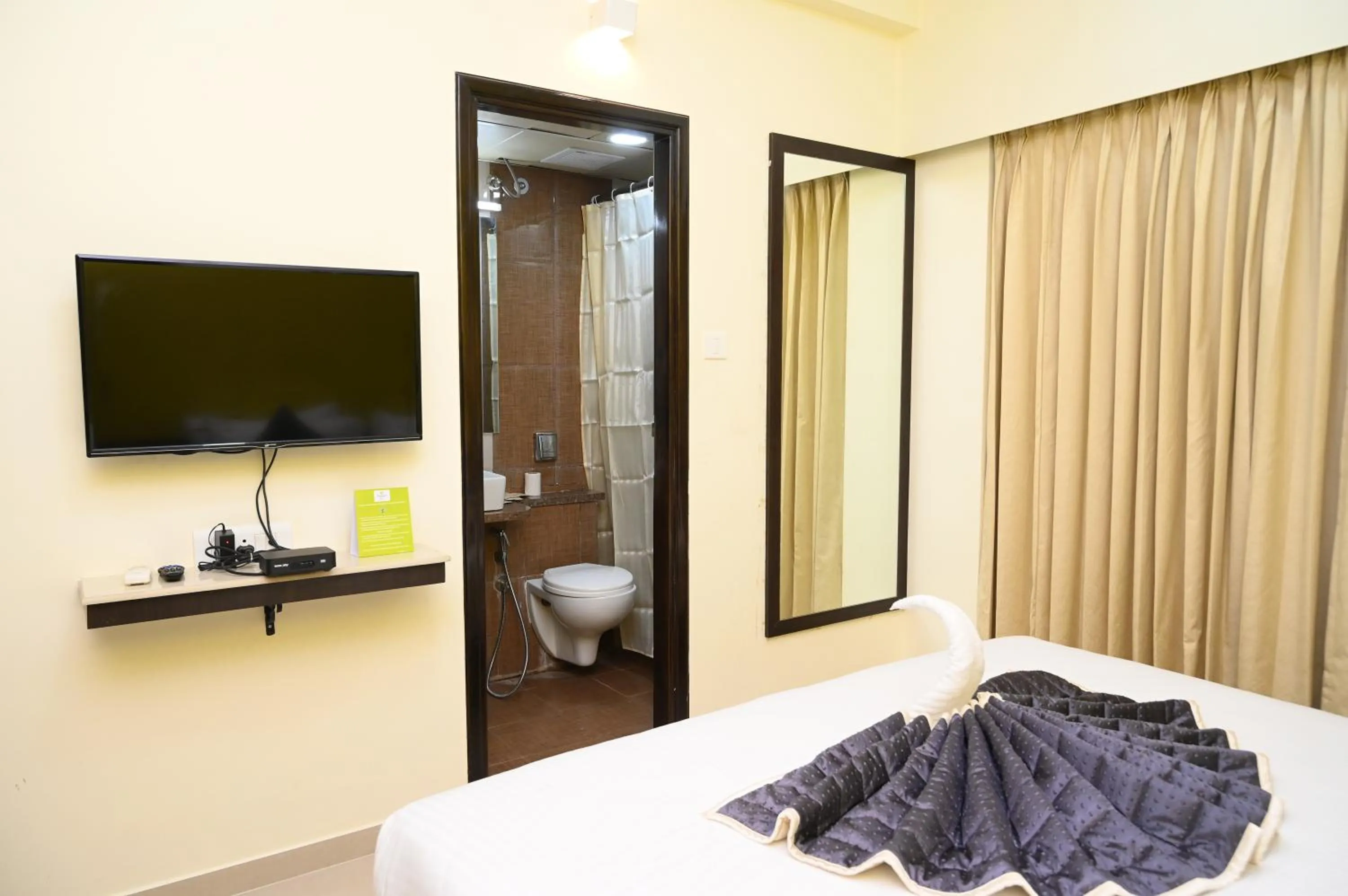 Bedroom, Bed in RAJKIYAM - A Business Hotel