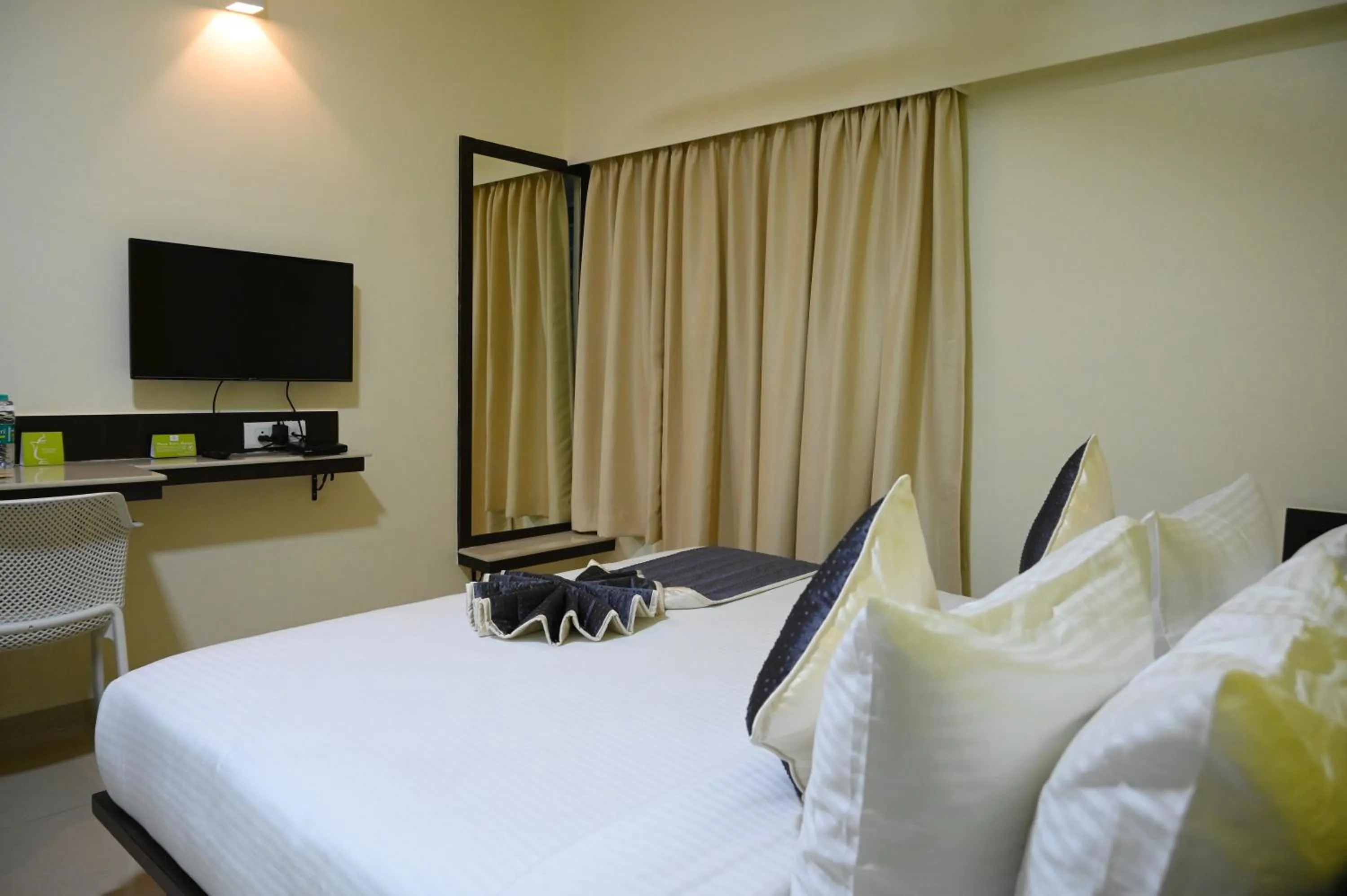 Bed in RAJKIYAM - A Business Hotel