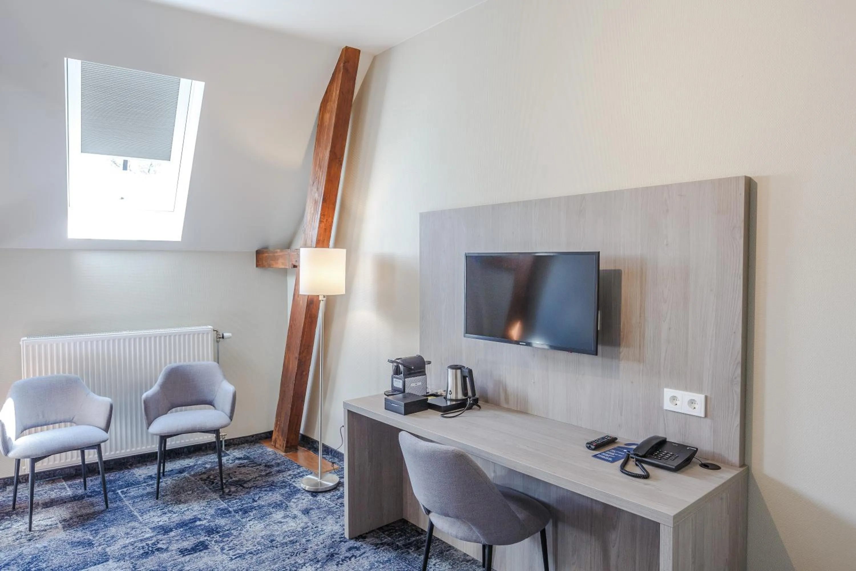 Living room in Fletcher Hotel Paleis Stadhouderlijk Hof