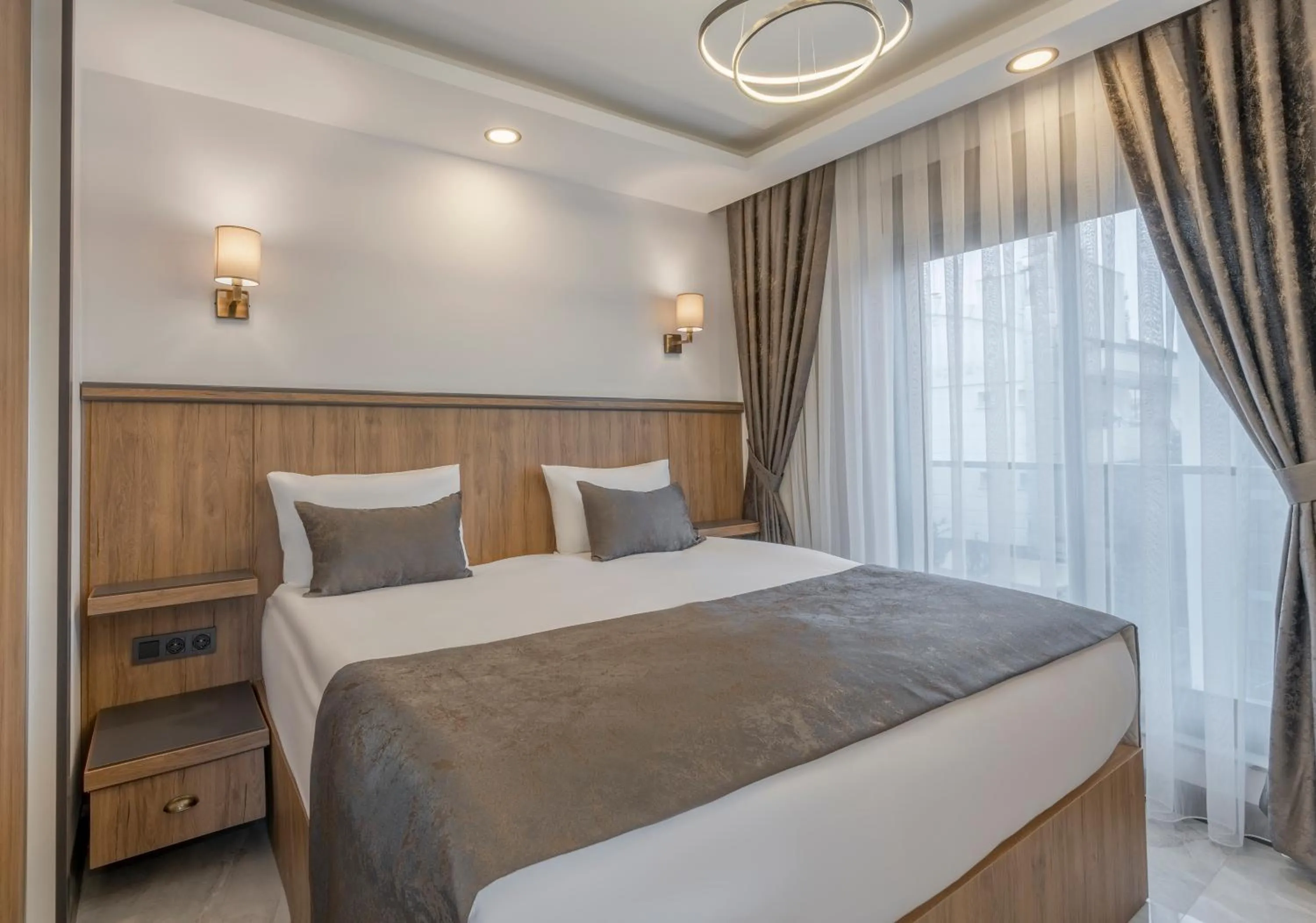 Bed in Quality Gold Suite Hotel