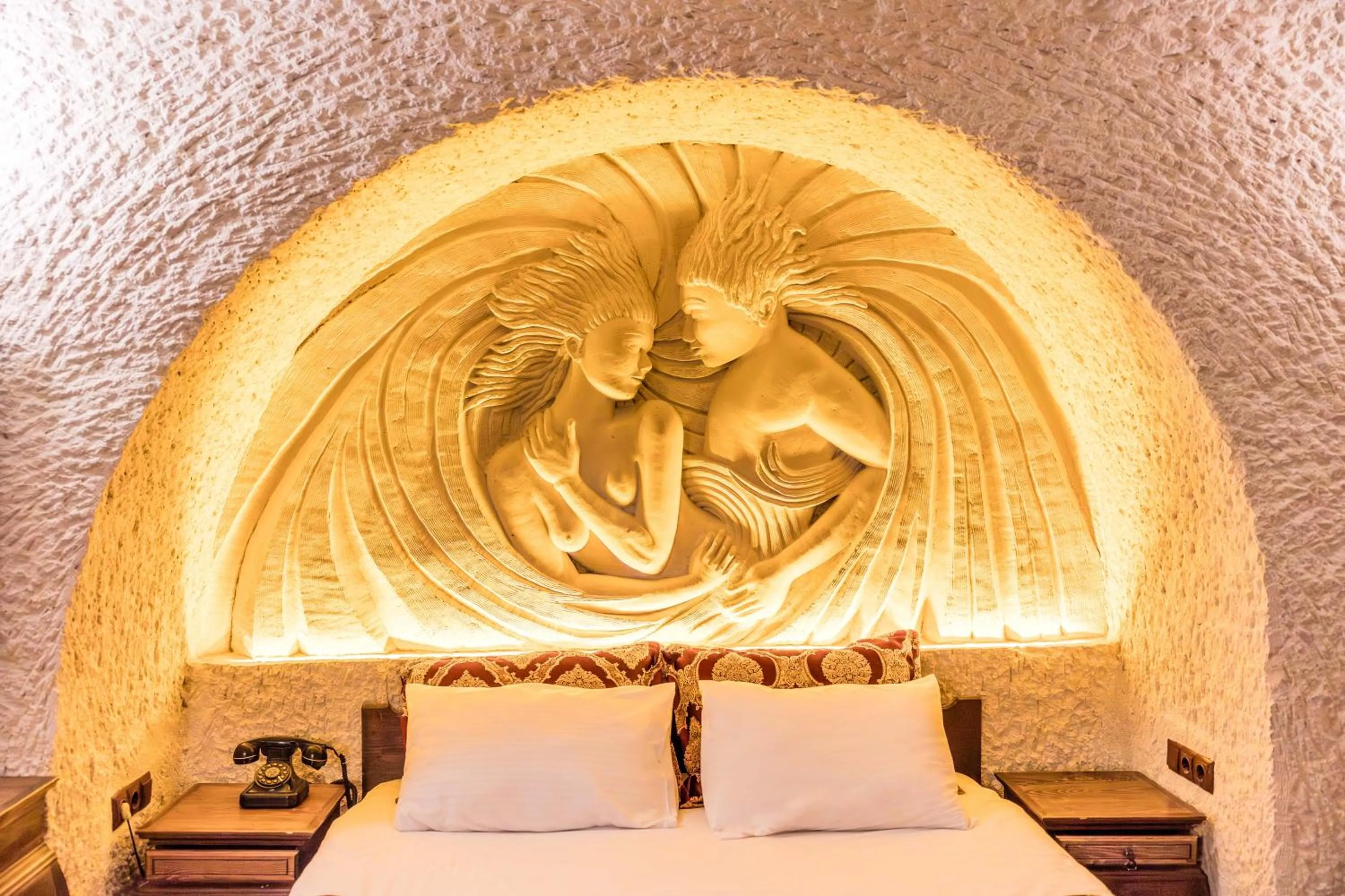 Bed in Phocas Cave Suites