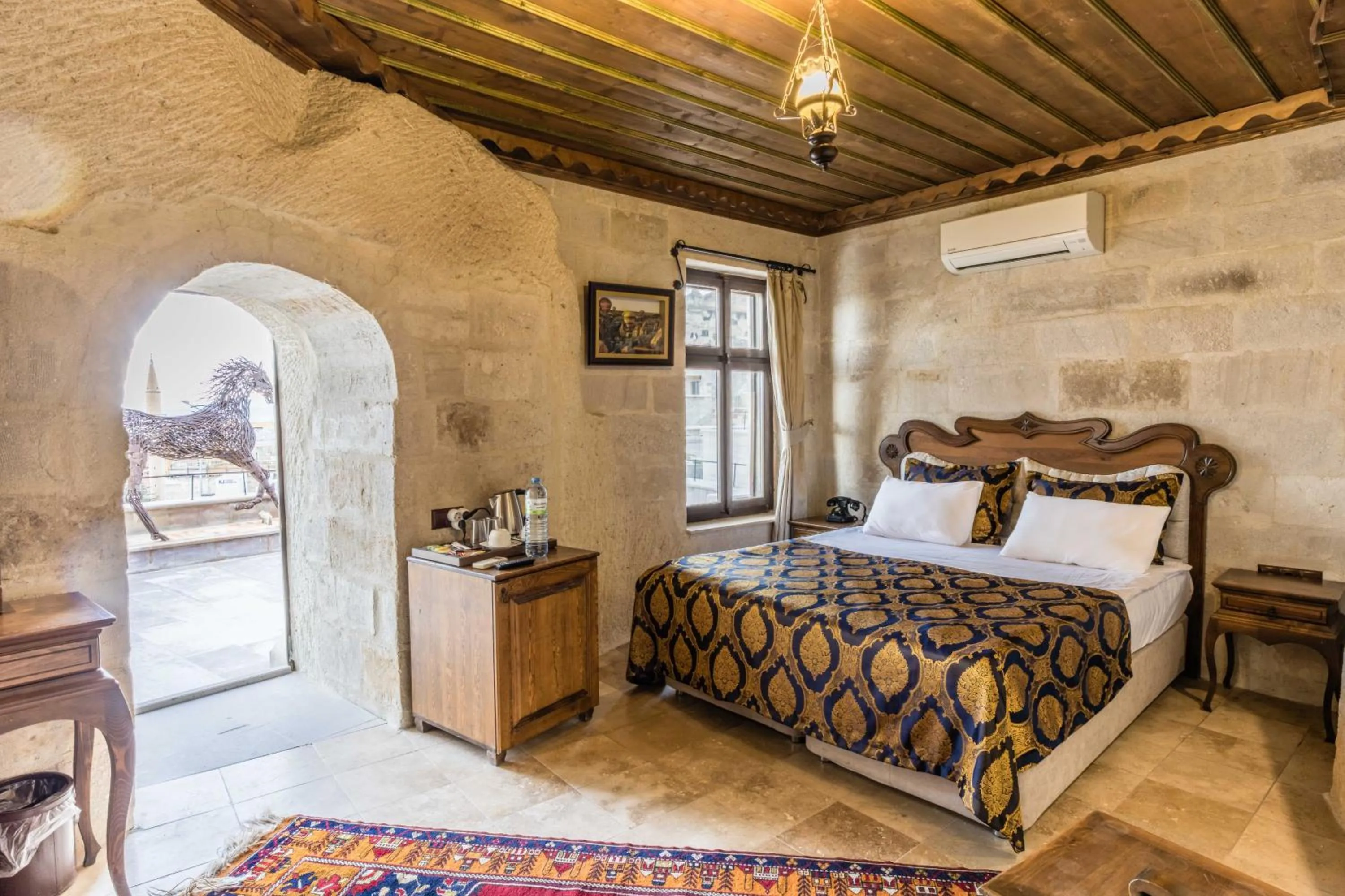 Bed in Phocas Cave Suites
