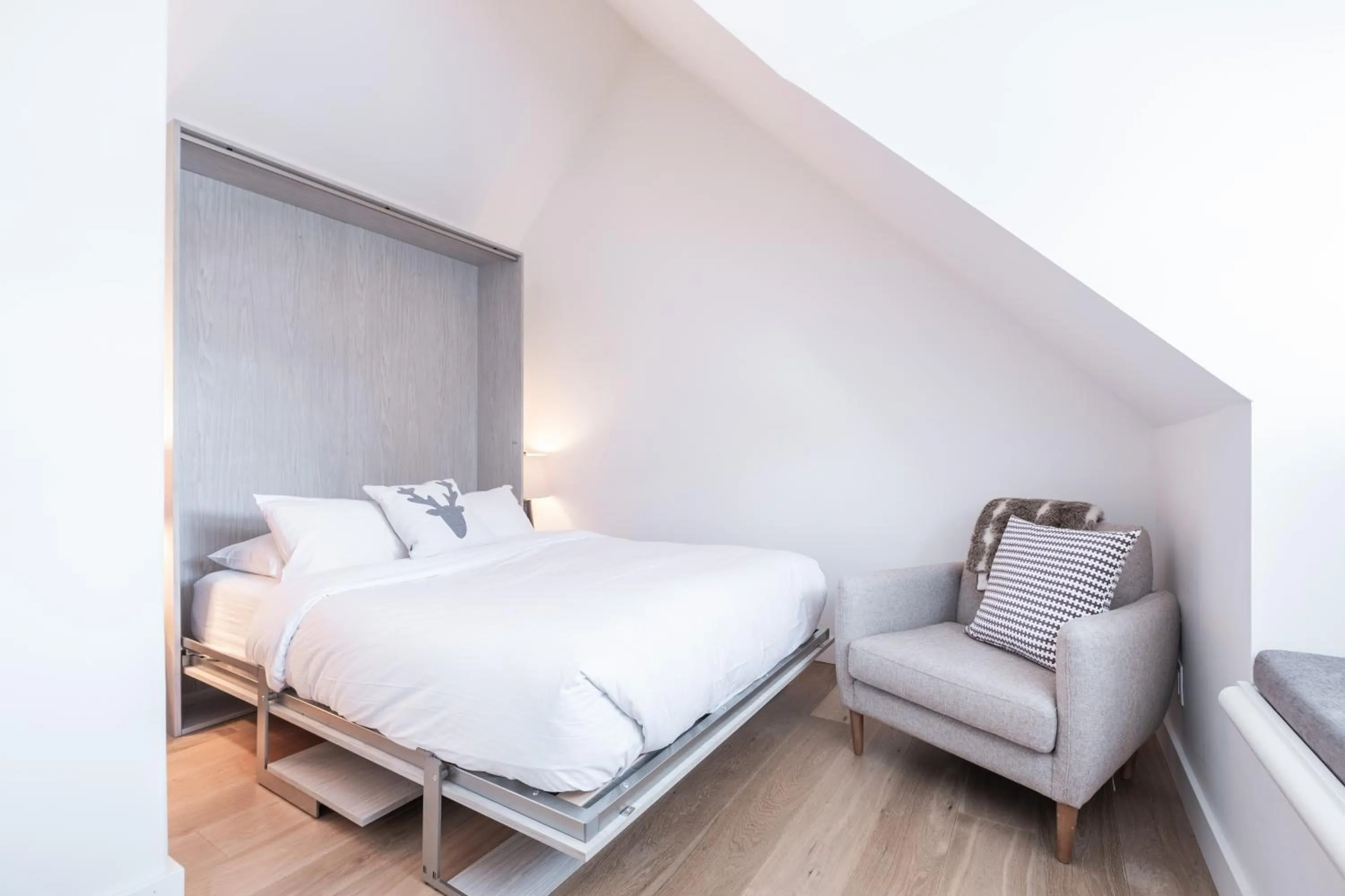 Bed in Lake Placid Lodge by Outpost Whistler