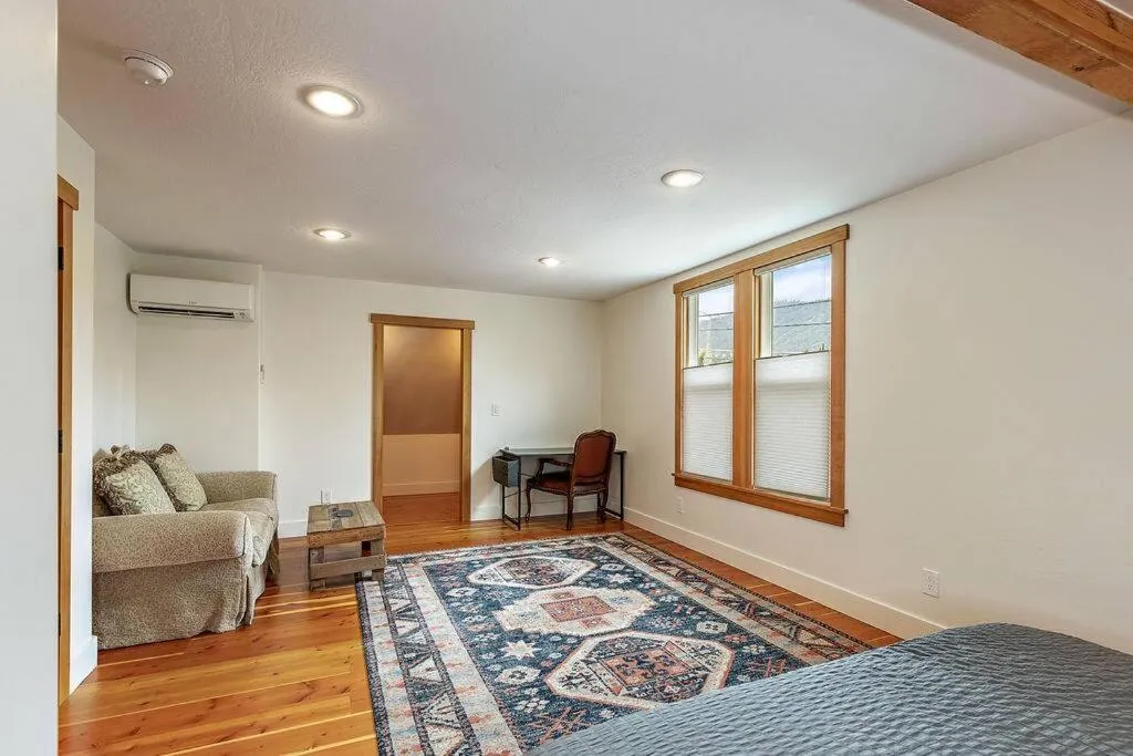 Seating area, Bed in The Mountain House by WanderLodges