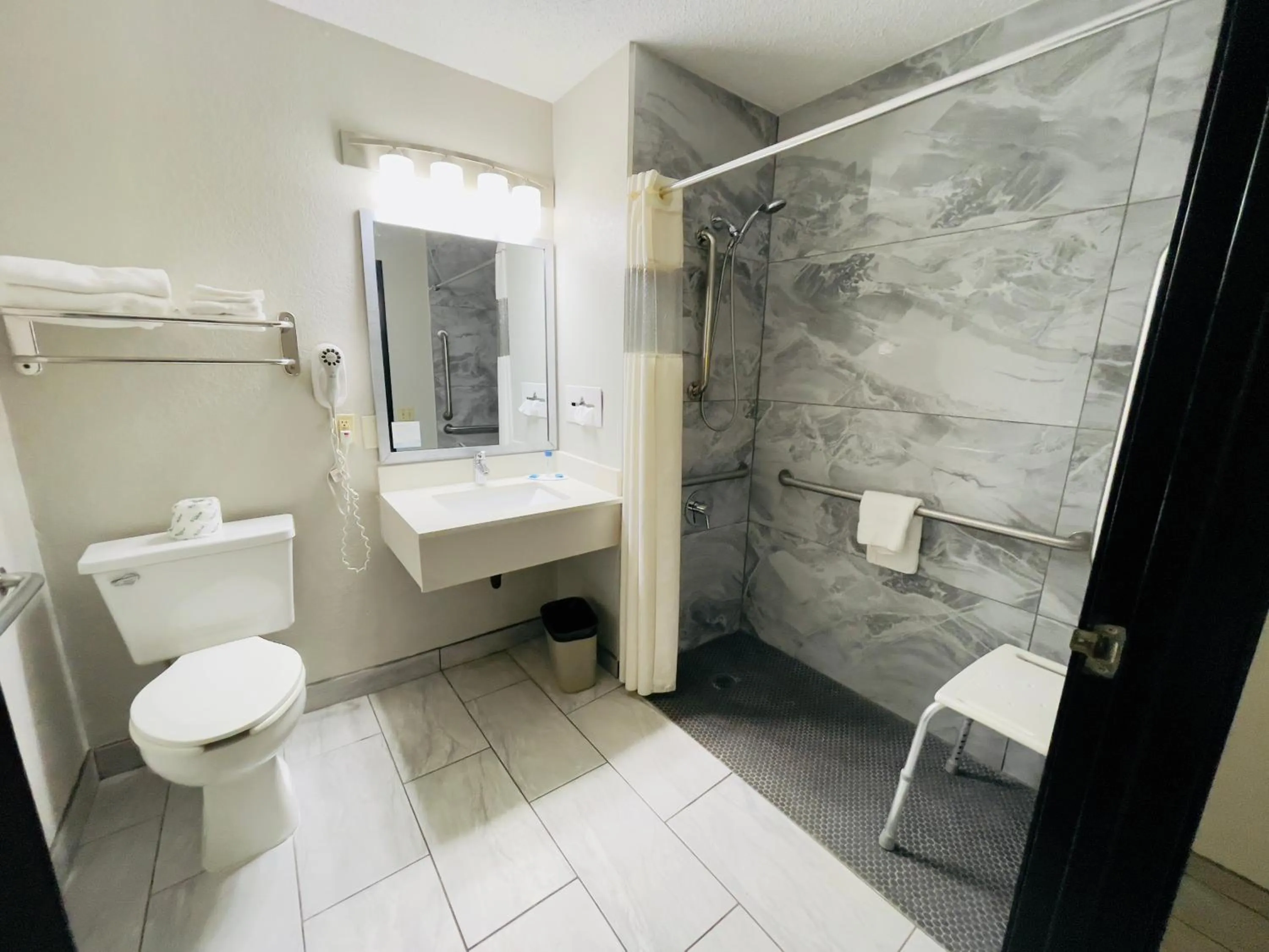 Bathroom in Super 8 by Wyndham Shakopee