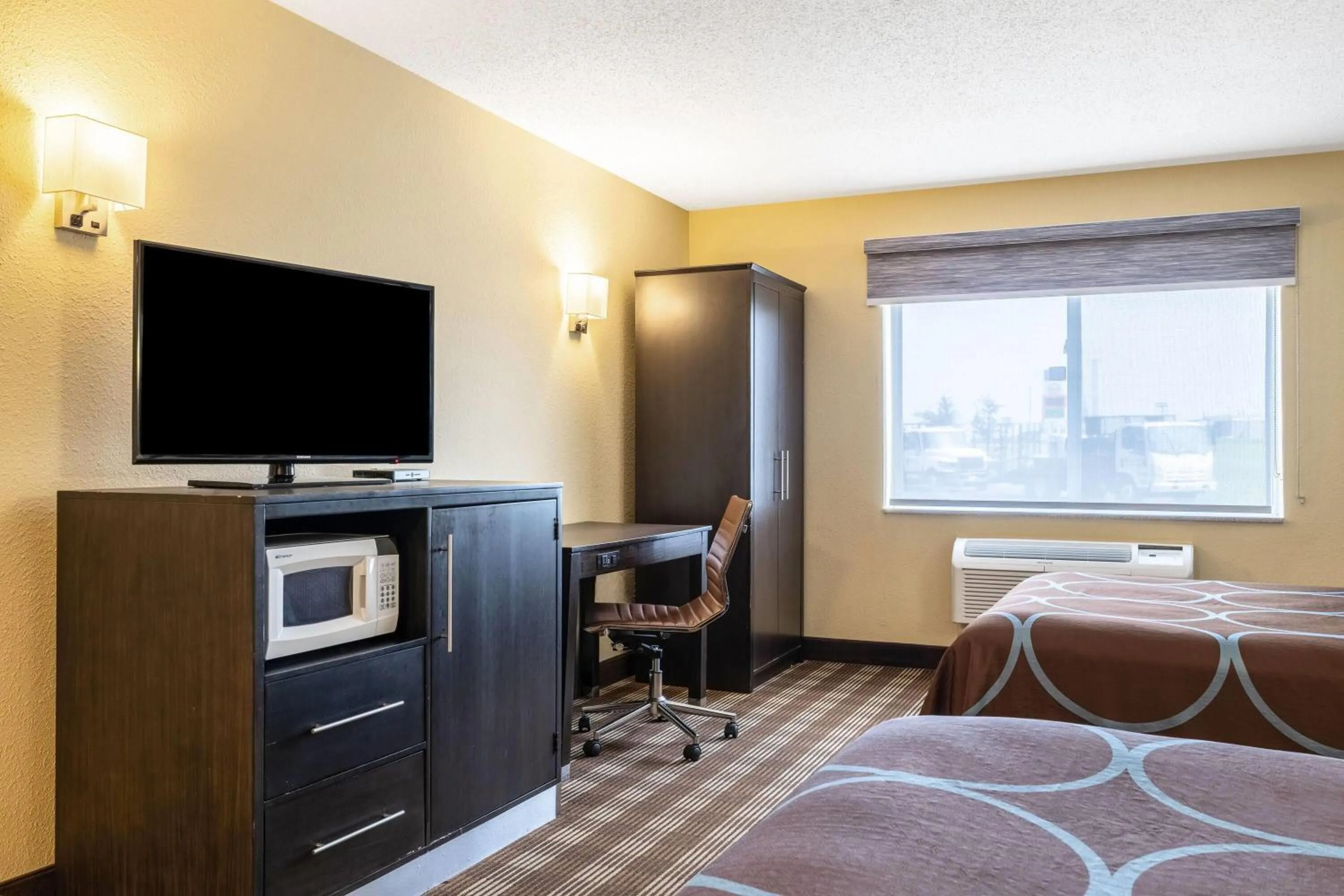 Bed in Super 8 by Wyndham Osseo WI