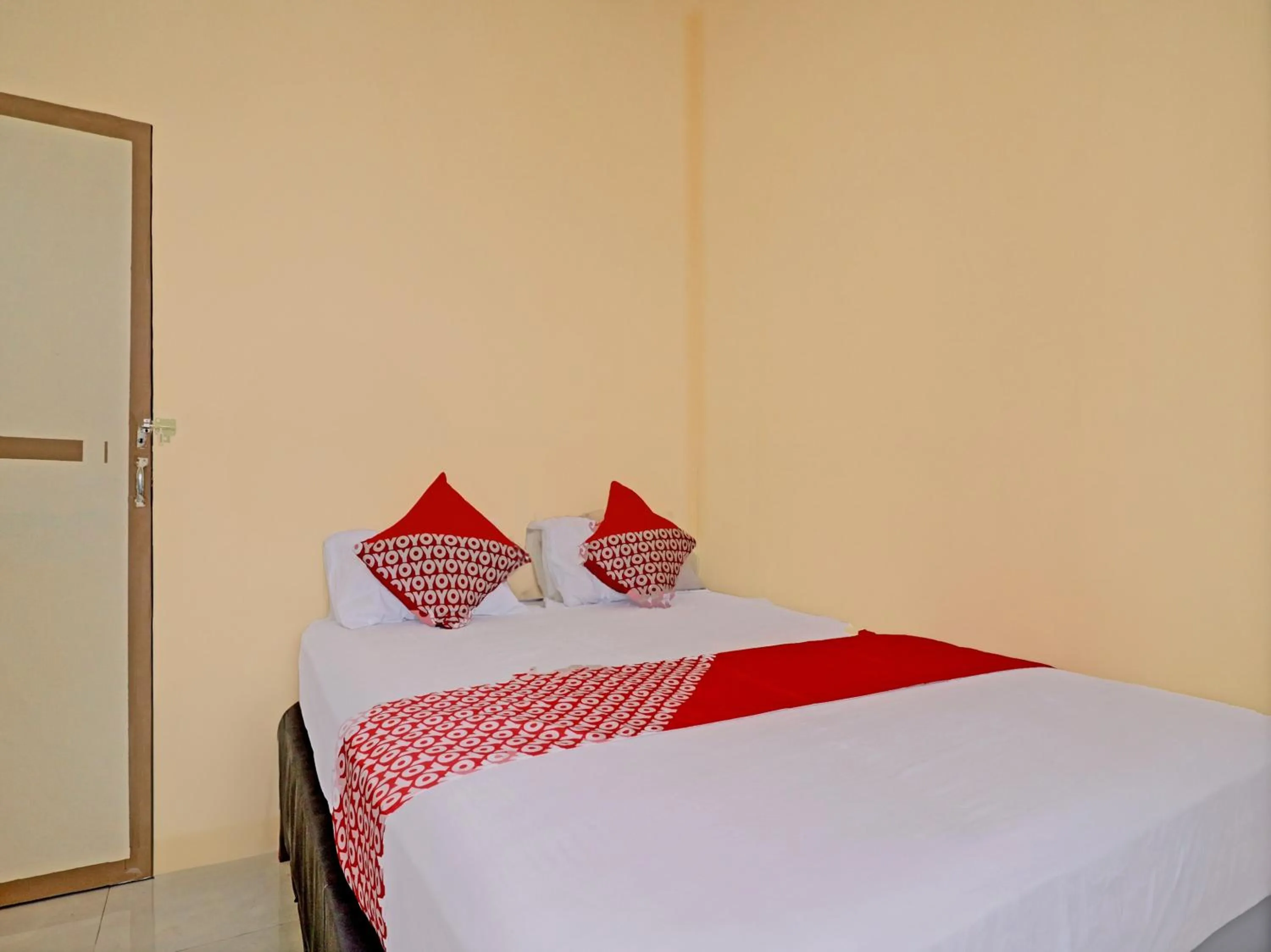 Bedroom in Hotel O Excellent Kost