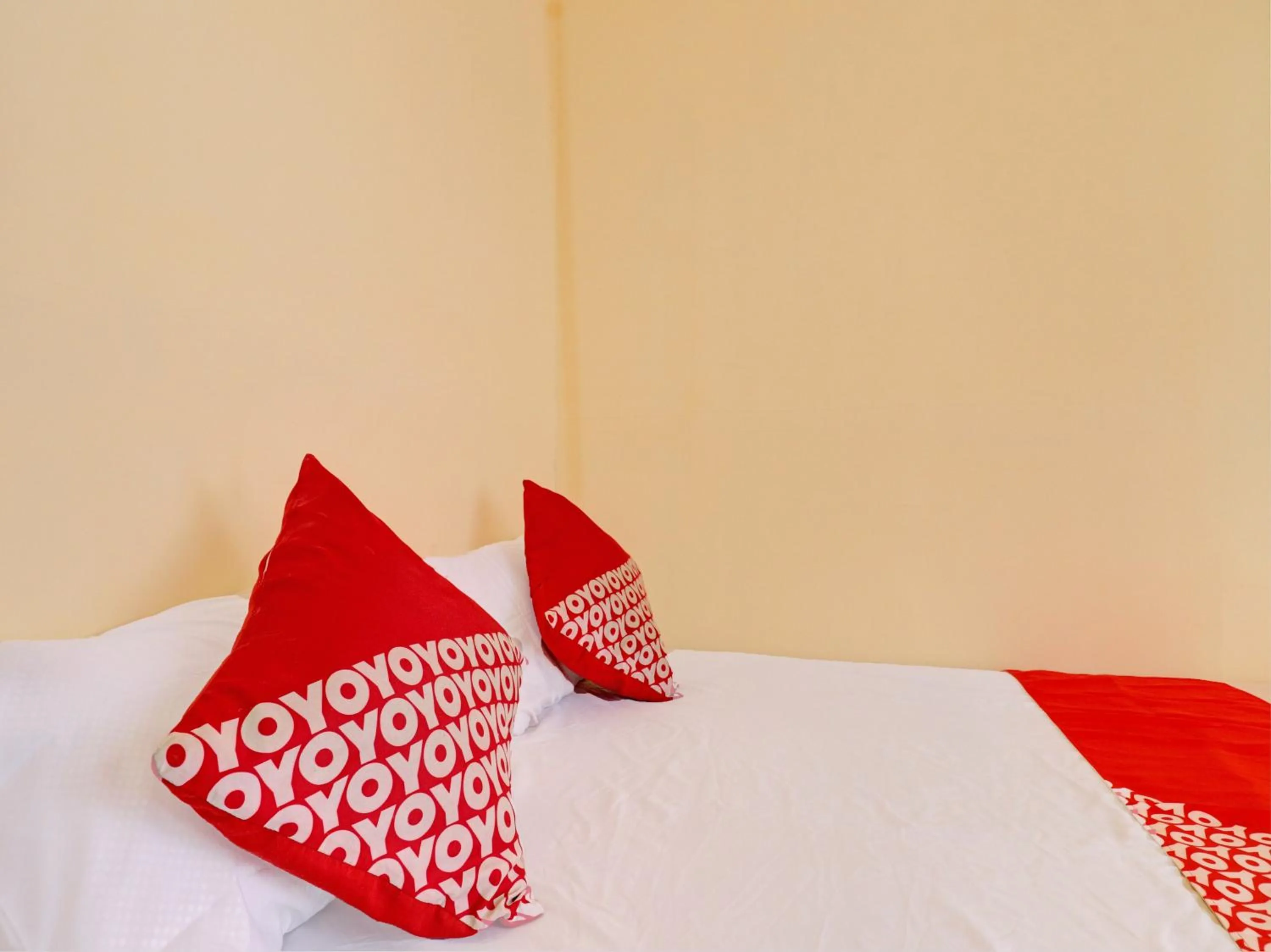 Bedroom in Hotel O Excellent Kost