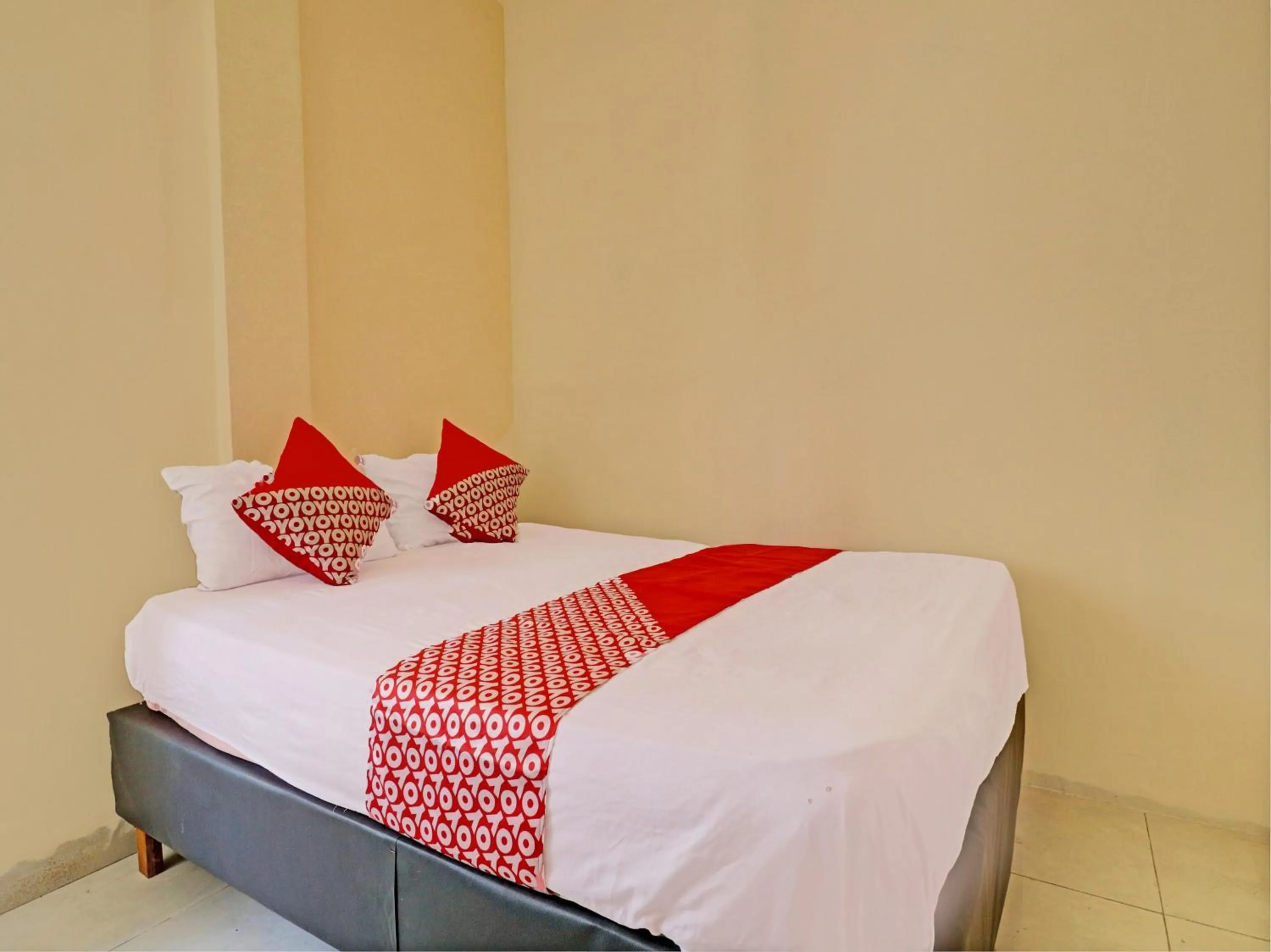 Bedroom in Hotel O Excellent Kost