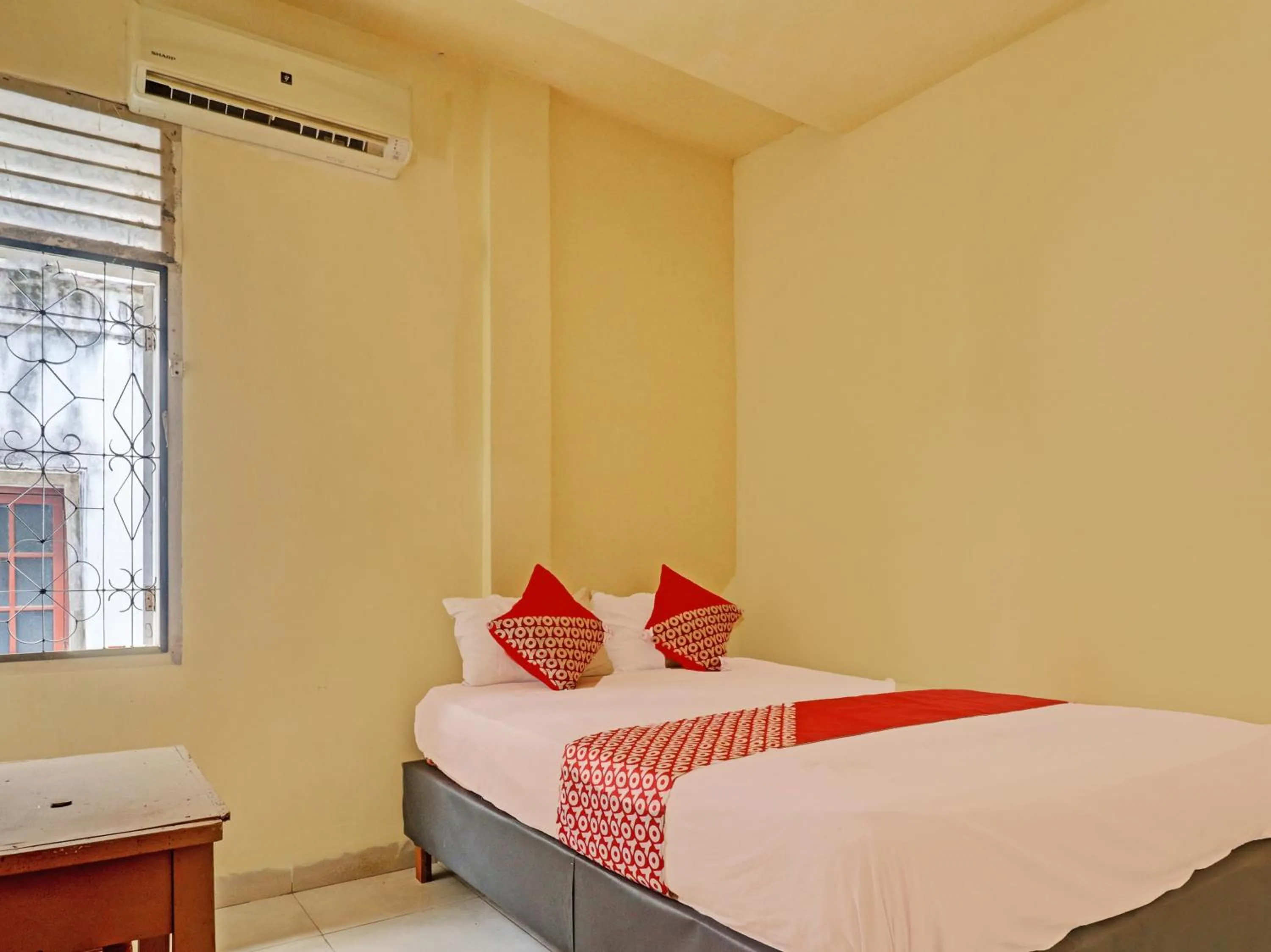 Bedroom in Hotel O Excellent Kost