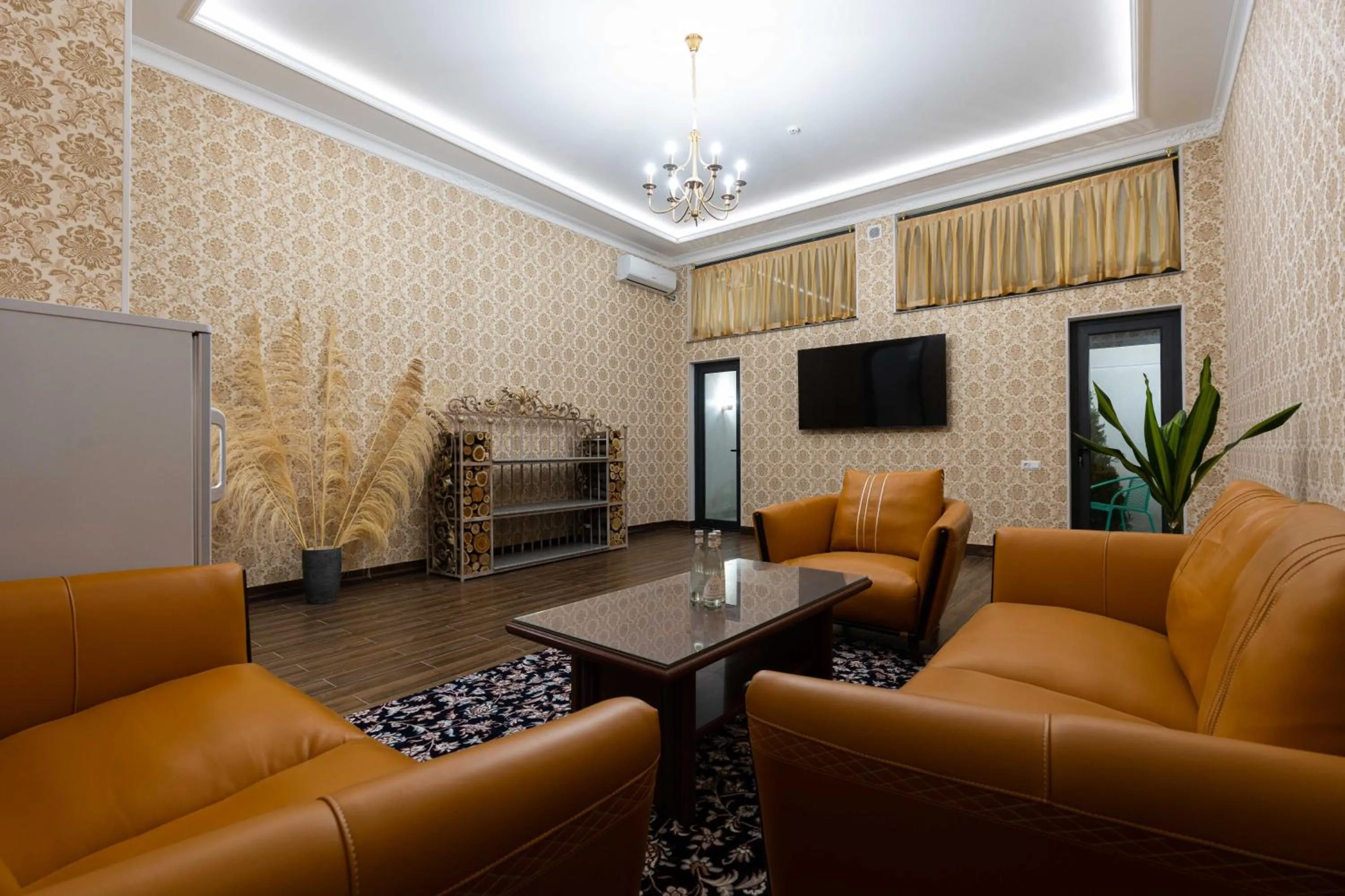 Communal lounge/ TV room in Aqua Hotel