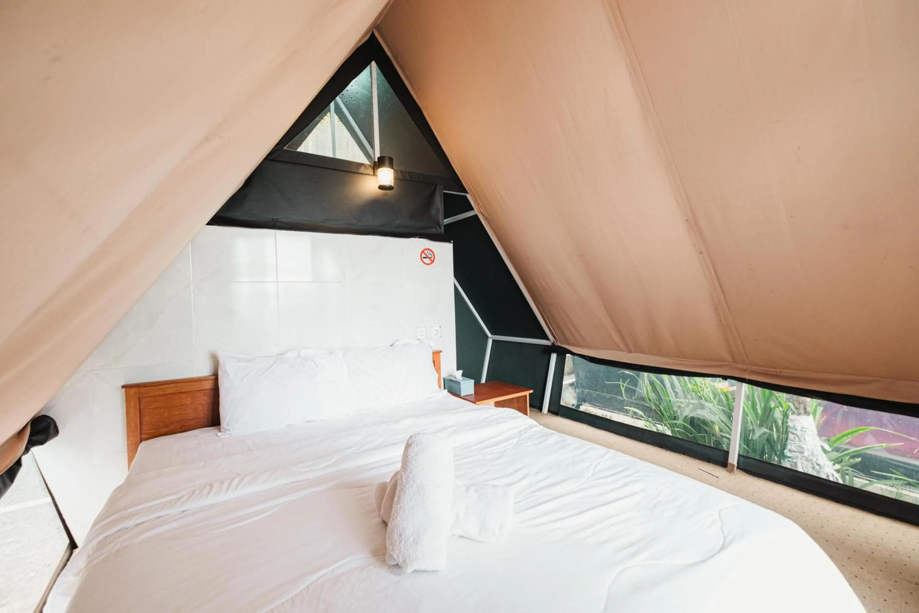Bed in Popitan Garden Campground & Glamping Bedugul