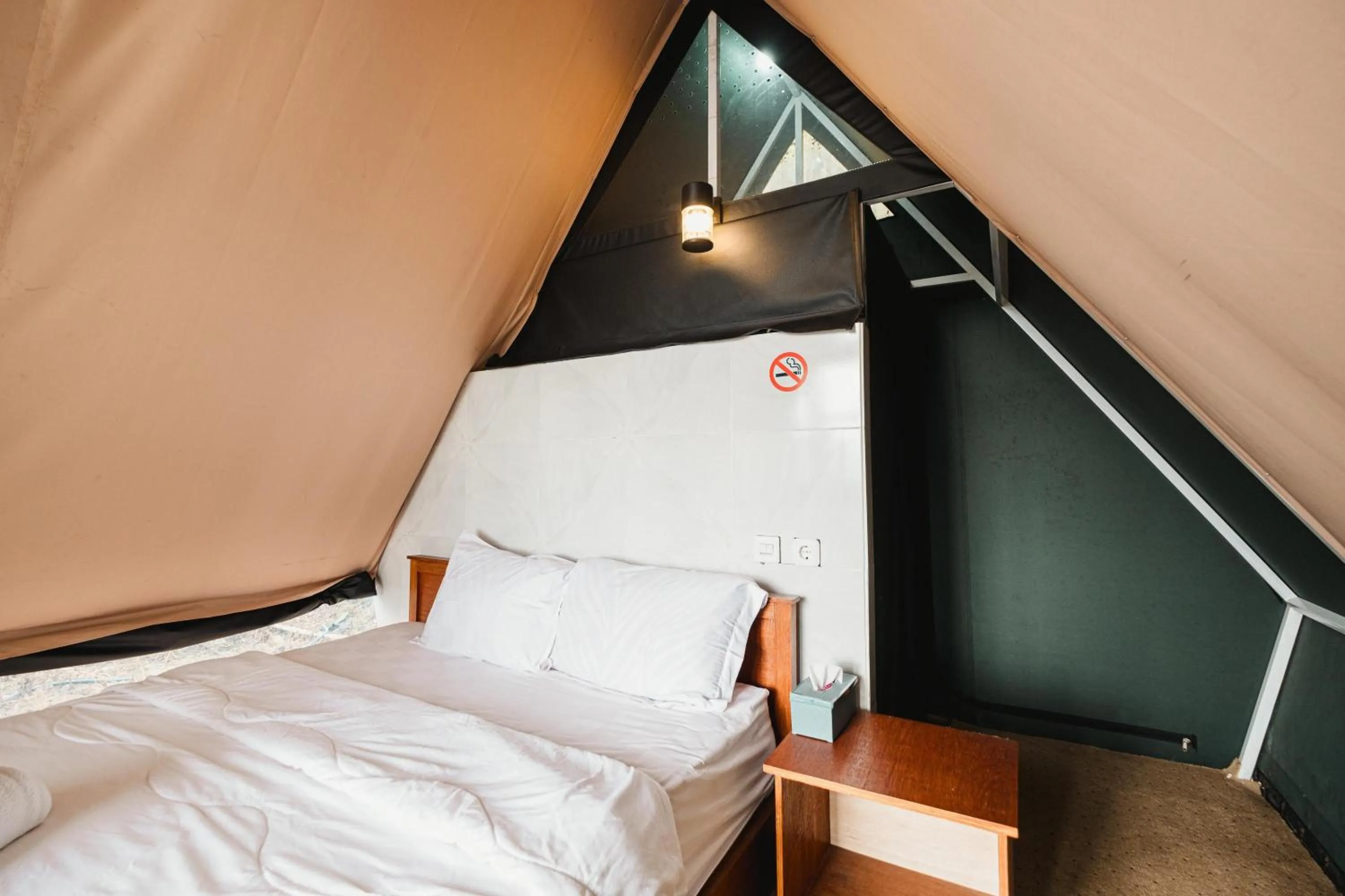 Bed in Popitan Garden Campground & Glamping Bedugul