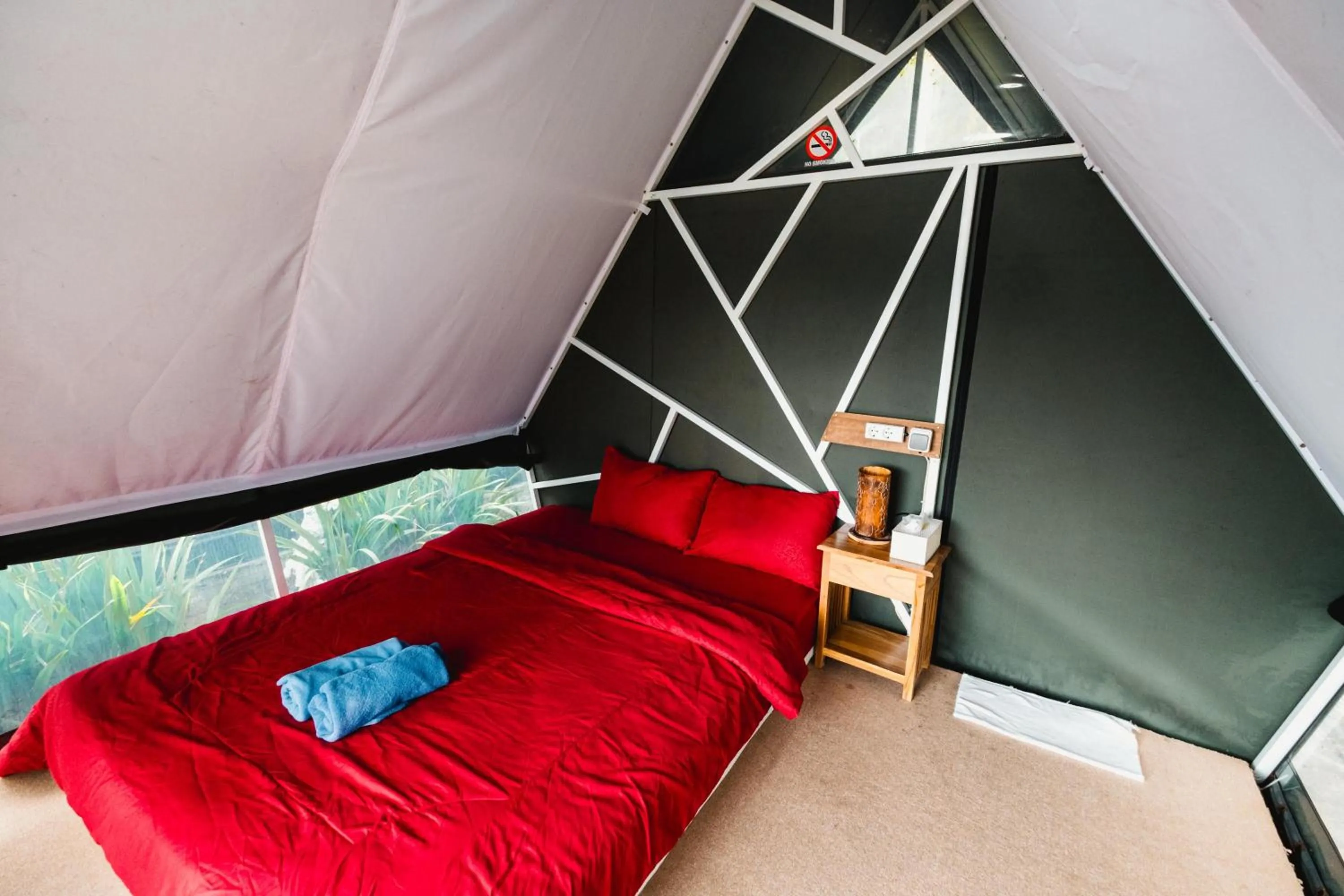 Bed in Popitan Garden Campground & Glamping Bedugul