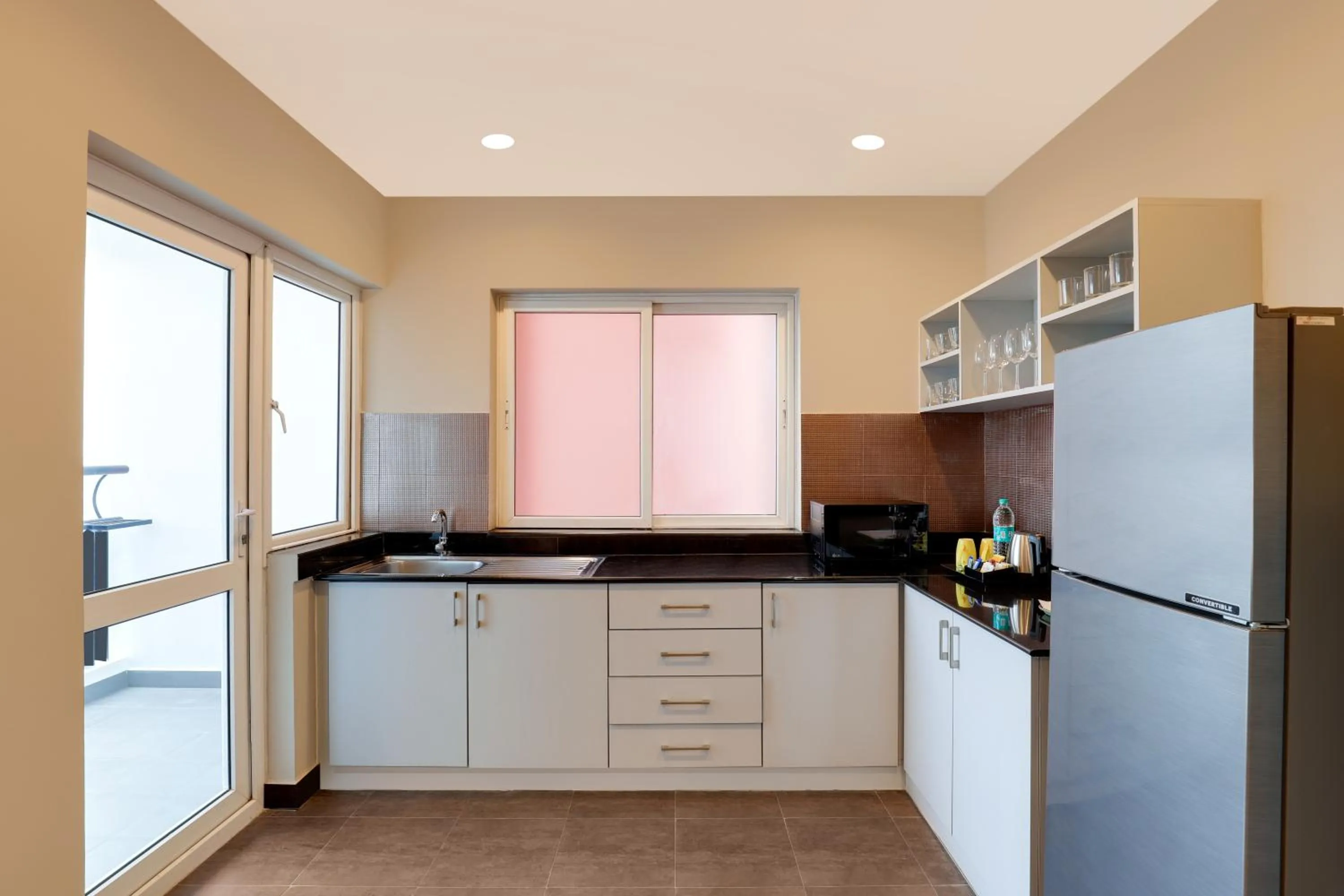 Kitchen or kitchenette in Lemon Tree Suites, Whitefield, Bengaluru