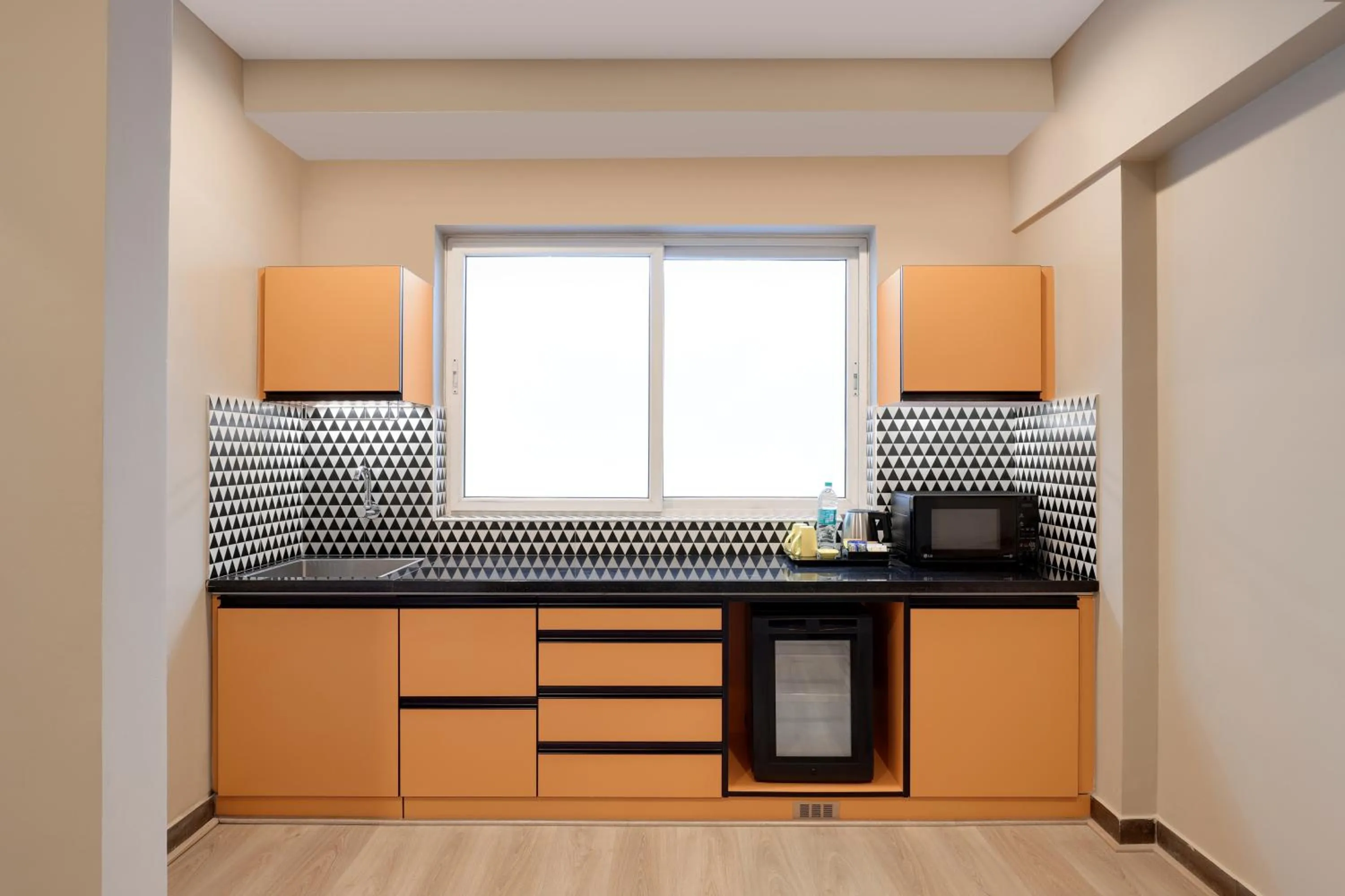 Kitchen or kitchenette in Lemon Tree Suites, Whitefield, Bengaluru