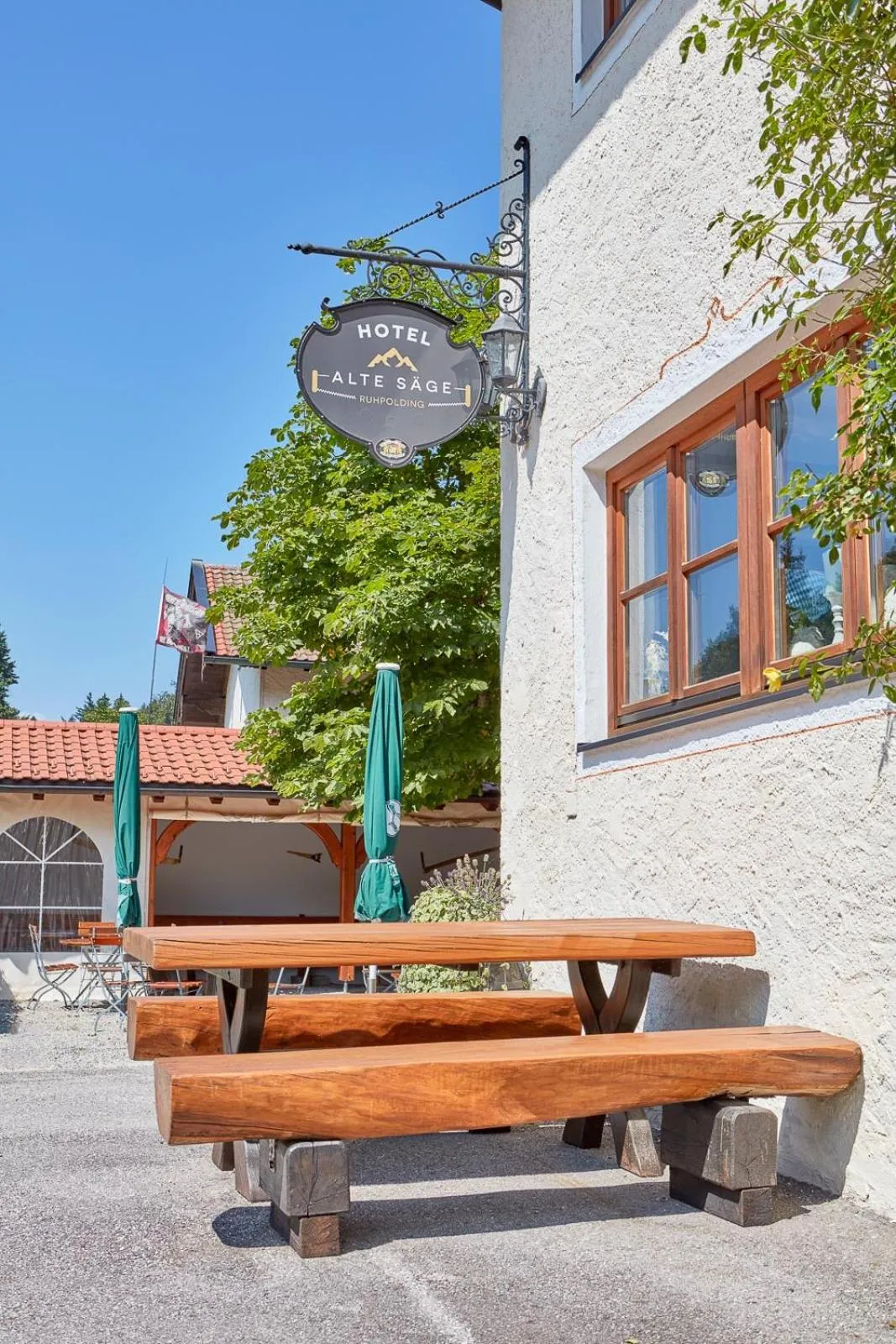 Garden view in Hotel Garni Alte Säge Ruhpolding inkl Chiemgaukarte