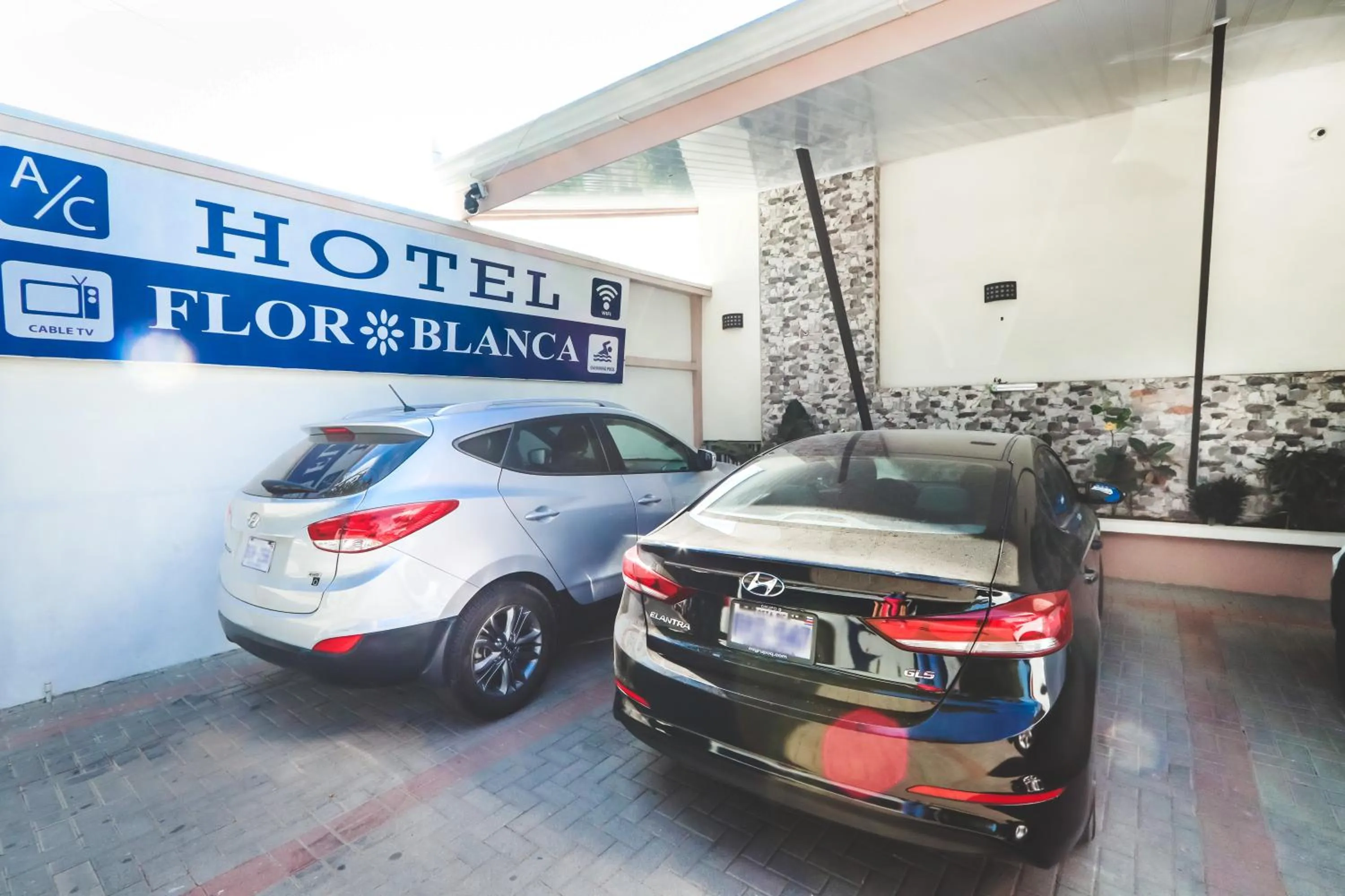 Property logo or sign in Hotel Flor Blanca