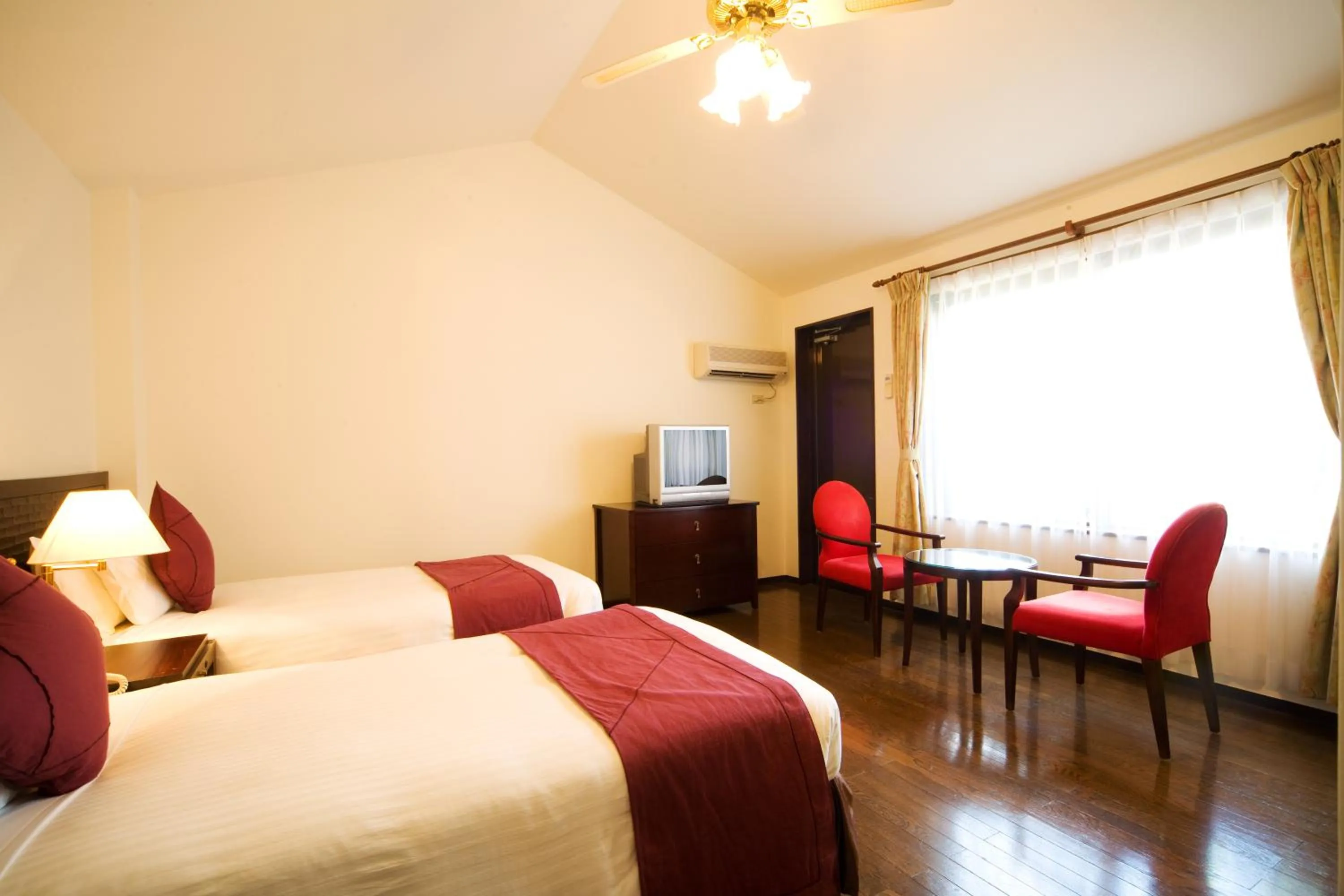 Photo of the whole room, Bed in Coco Garden Resort Okinawa