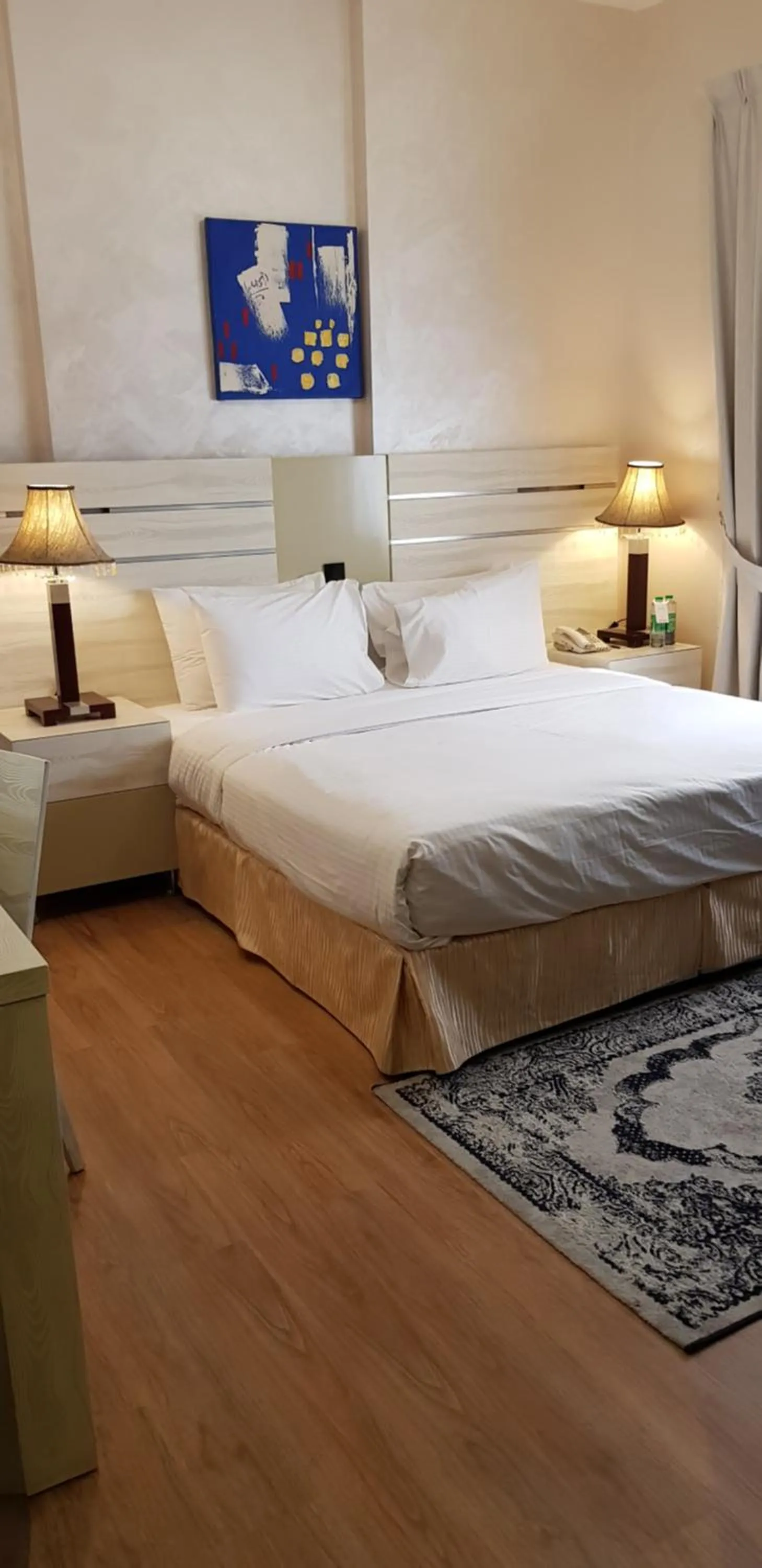 Bed in Boulevard City Suites Hotel Apartments