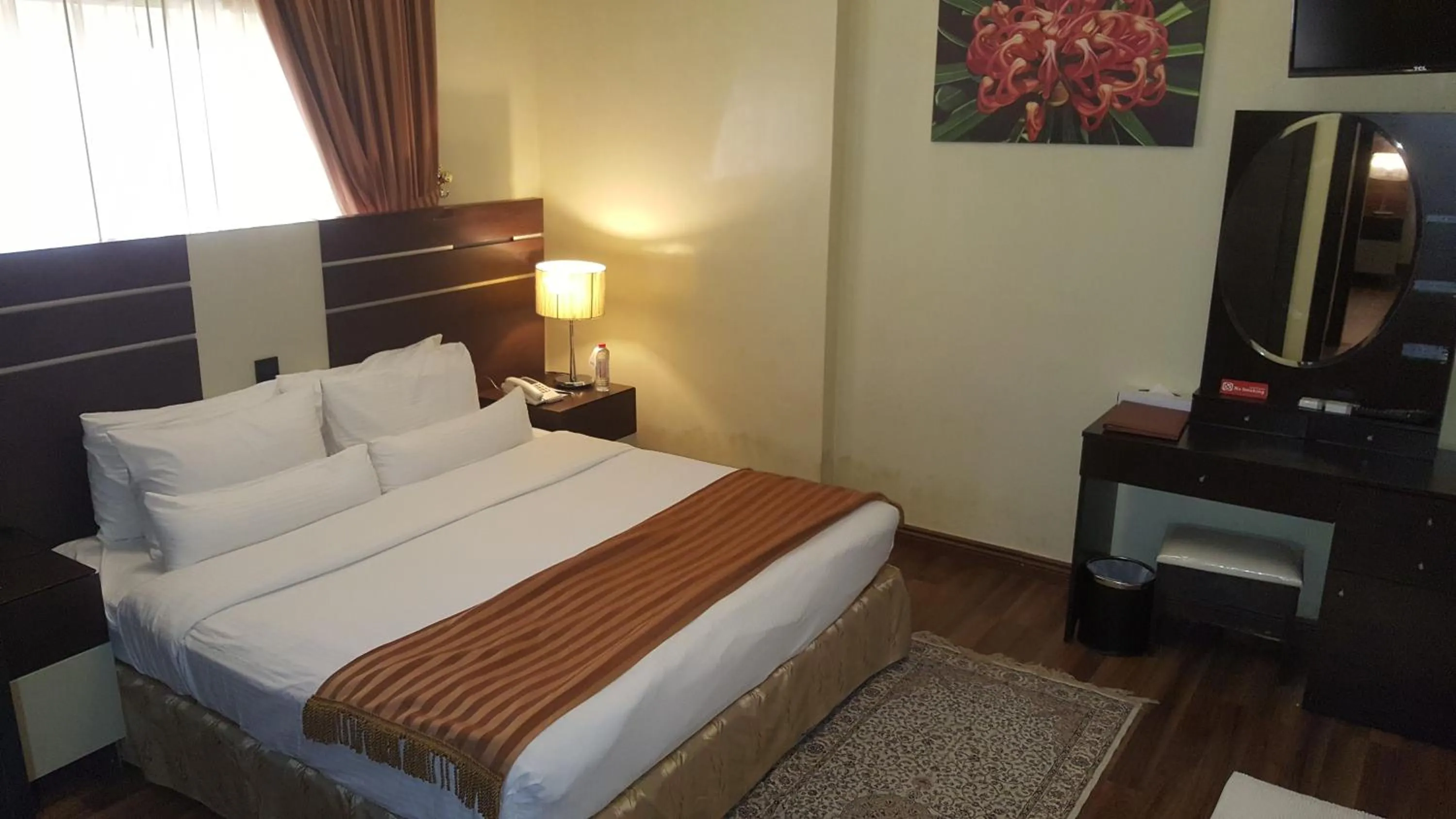 Bed in Boulevard City Suites Hotel Apartments